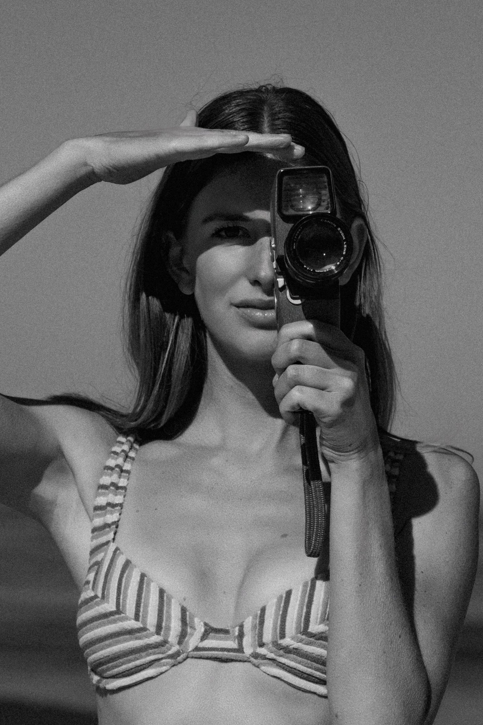 a woman in a white dress holding a bouquet of flowers
