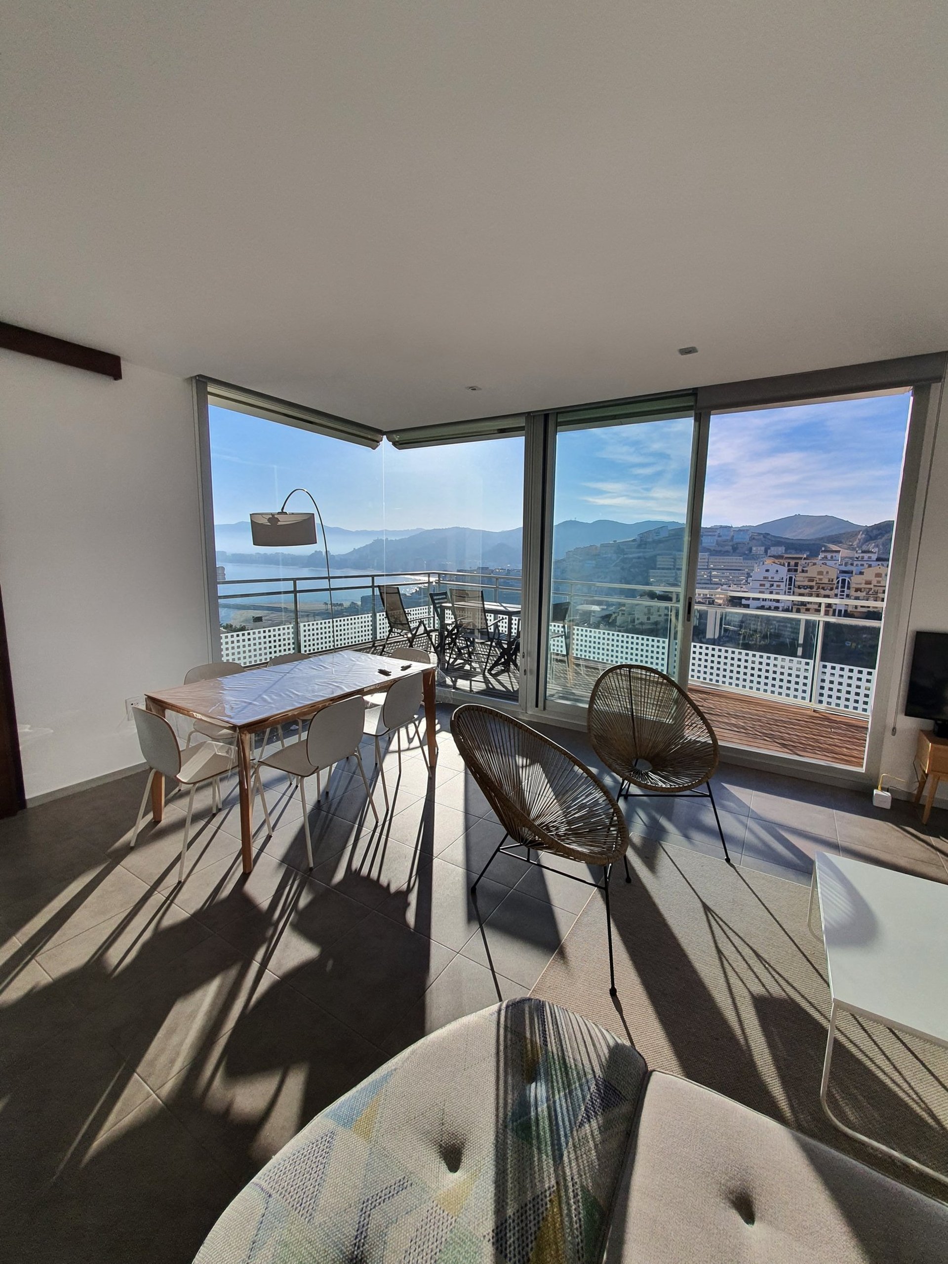 a person sitting on a couch with a laptop