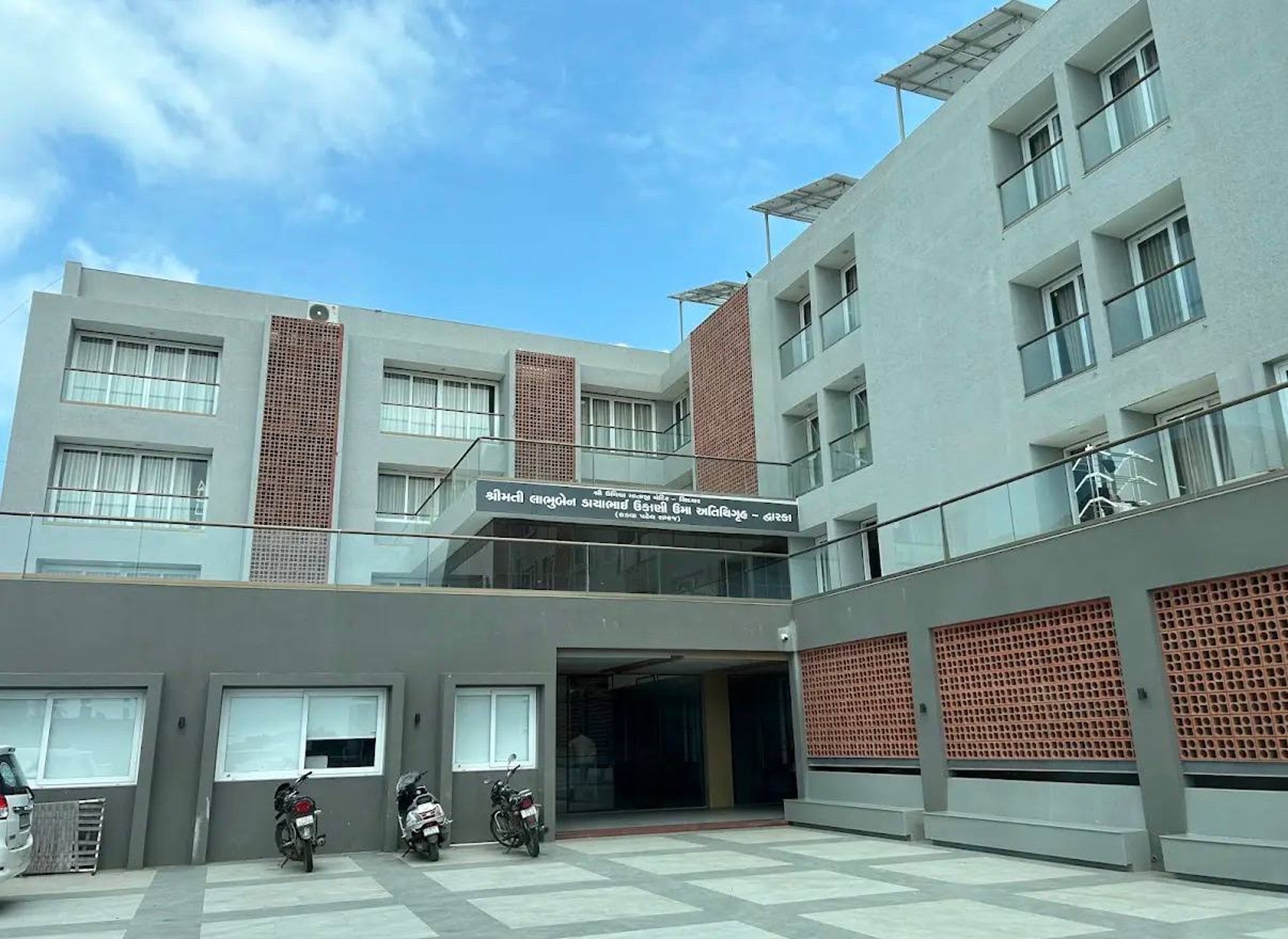 woman wearing yellow long-sleeved dress under white clouds and blue sky during daytime