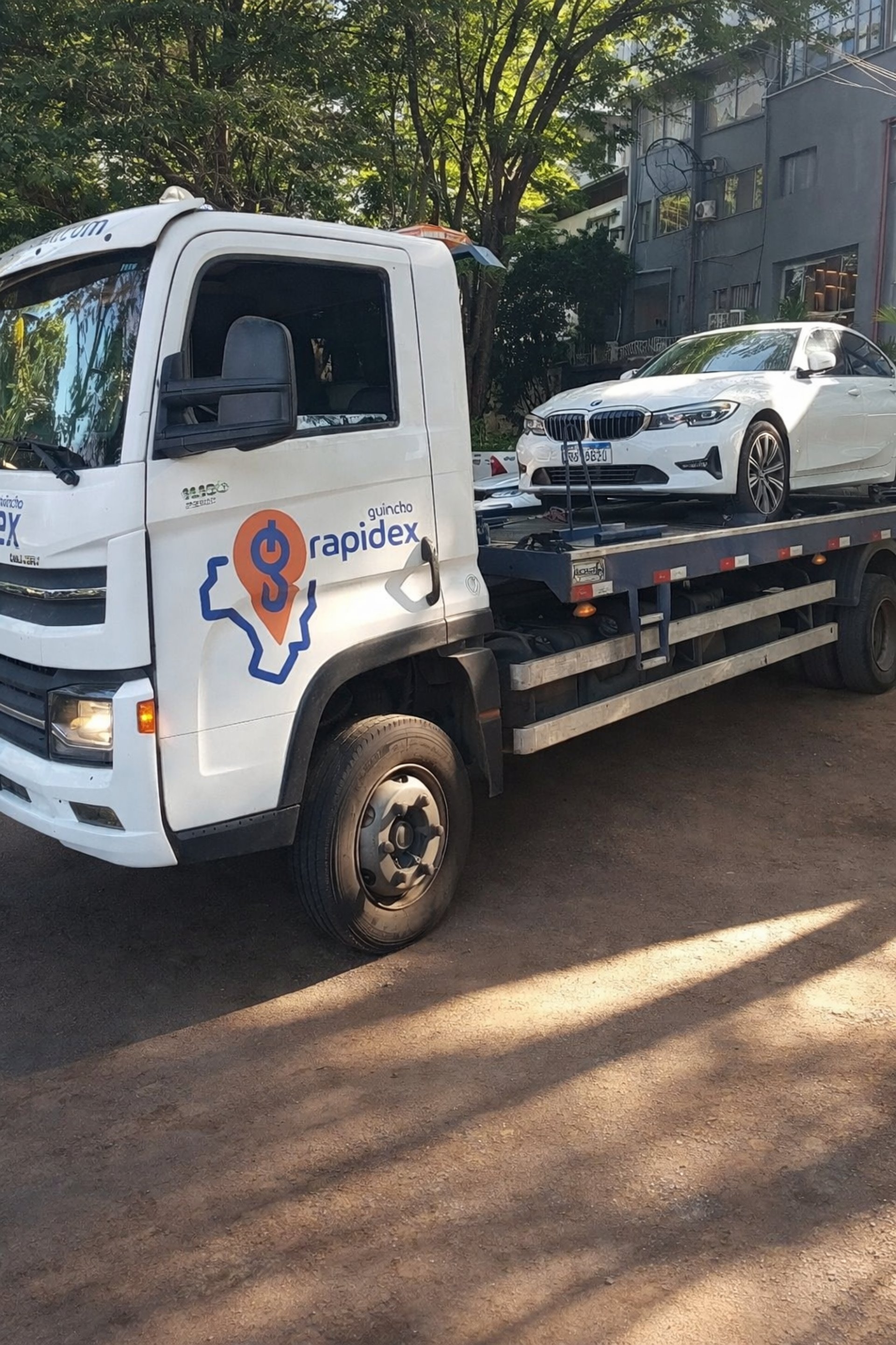 an abstract photo of a curved building with a blue sky in the background