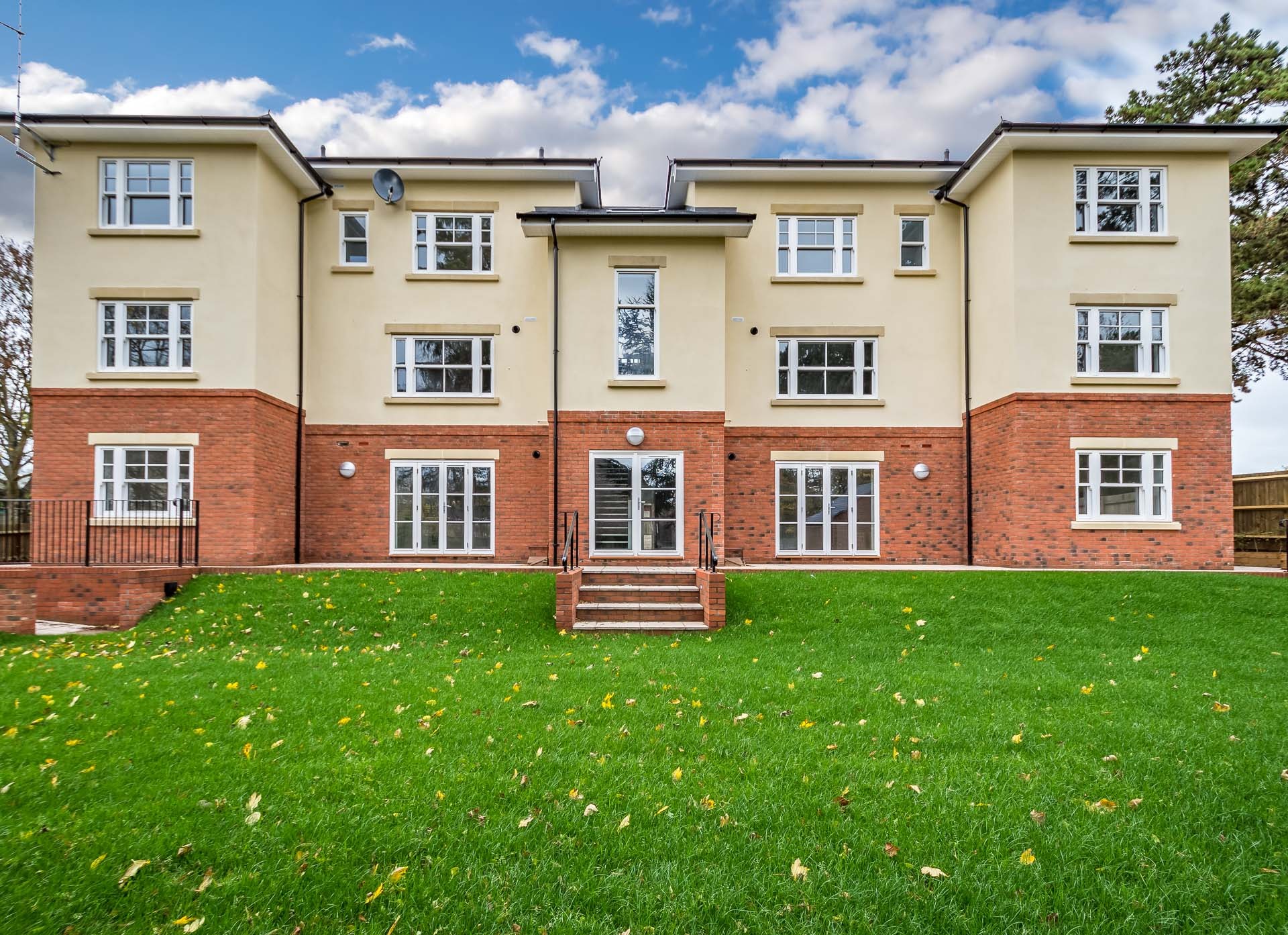 an abstract photo of a curved building with a blue sky in the background