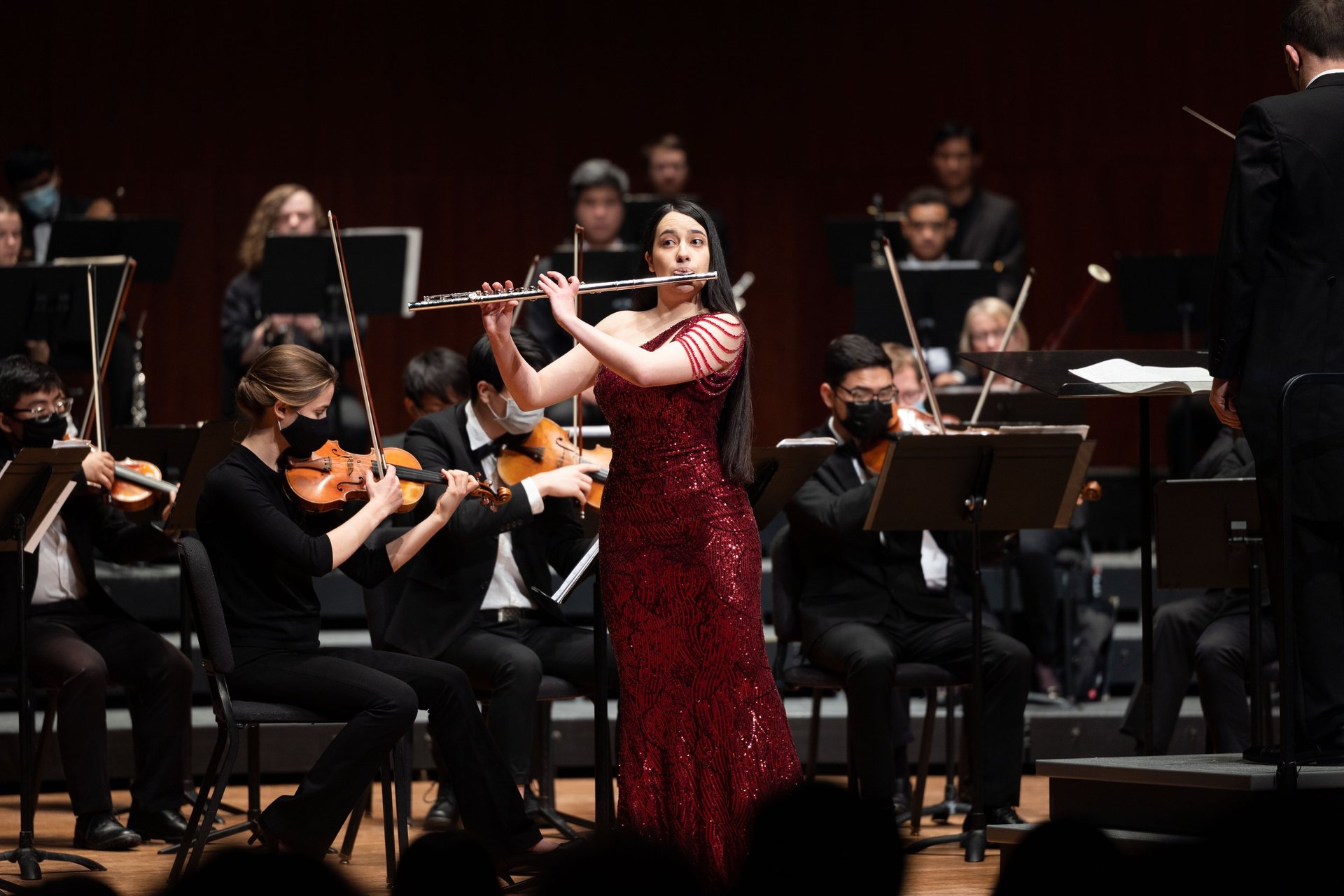 an abstract photo of a curved building with a blue sky in the background