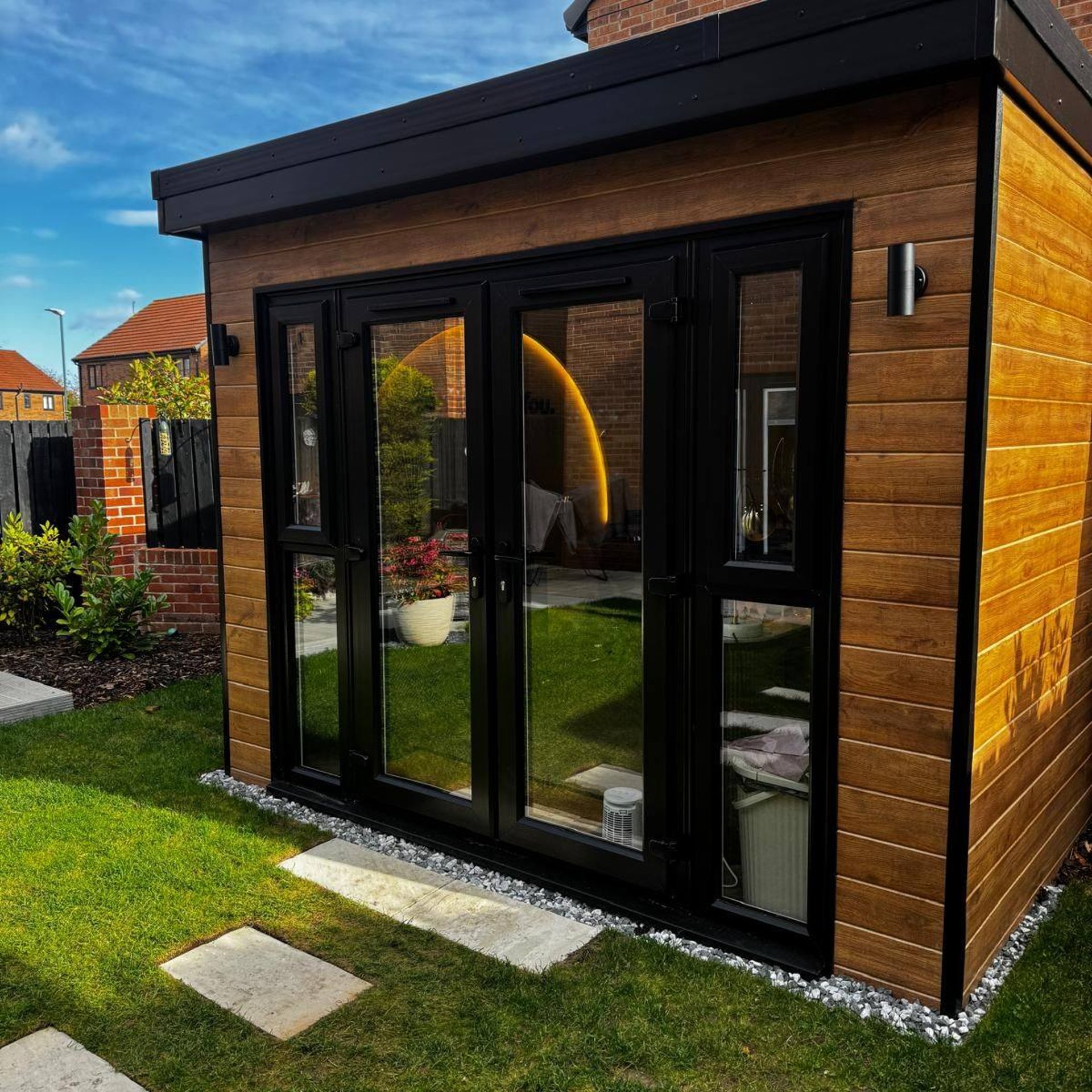 black and brown leather padded tub sofa