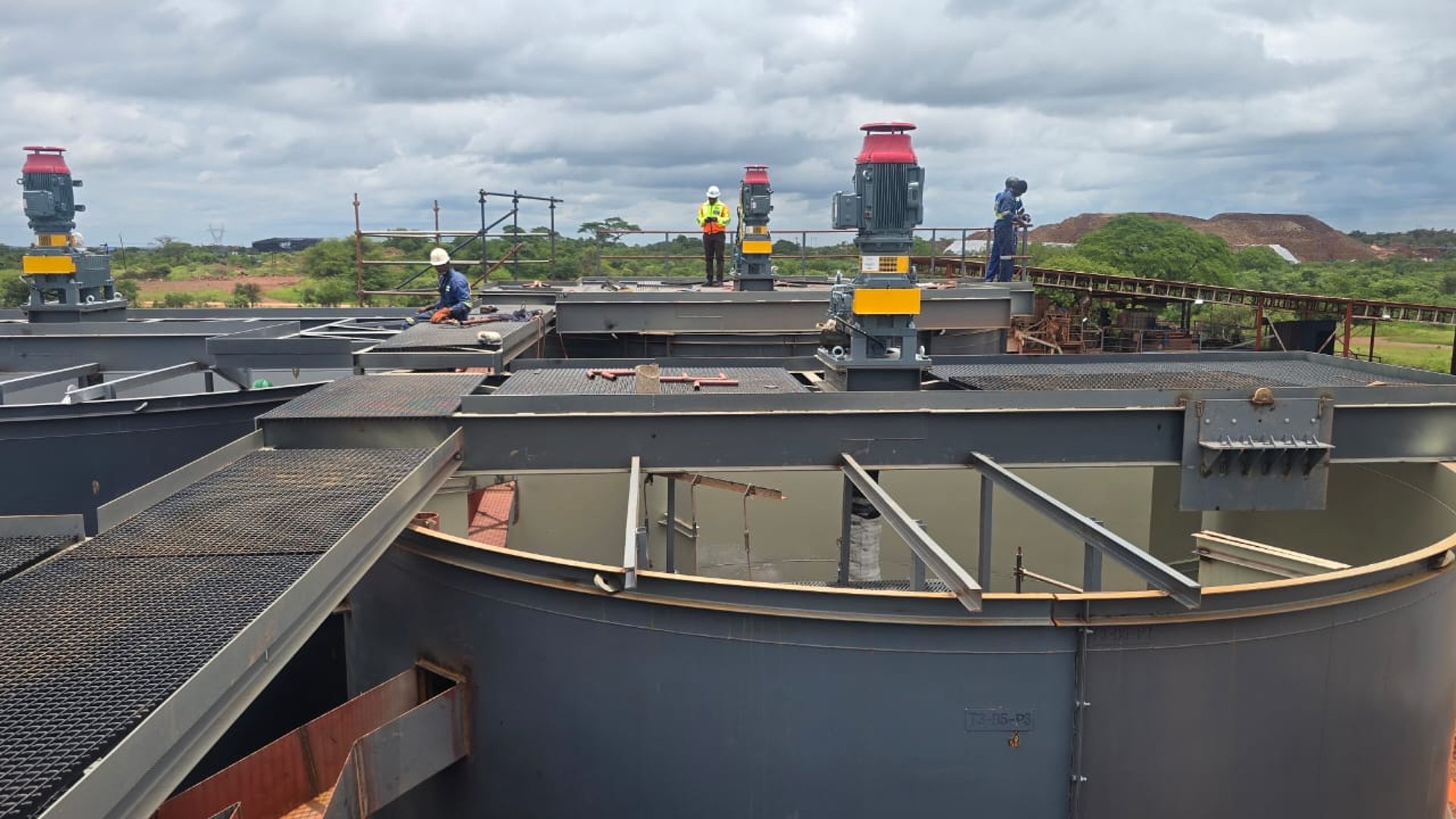 several cranes above the buildings