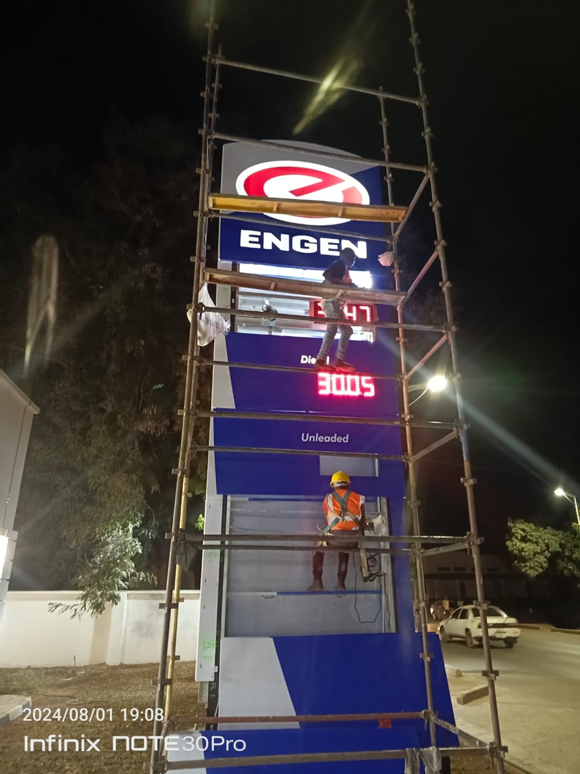 several cranes above the buildings