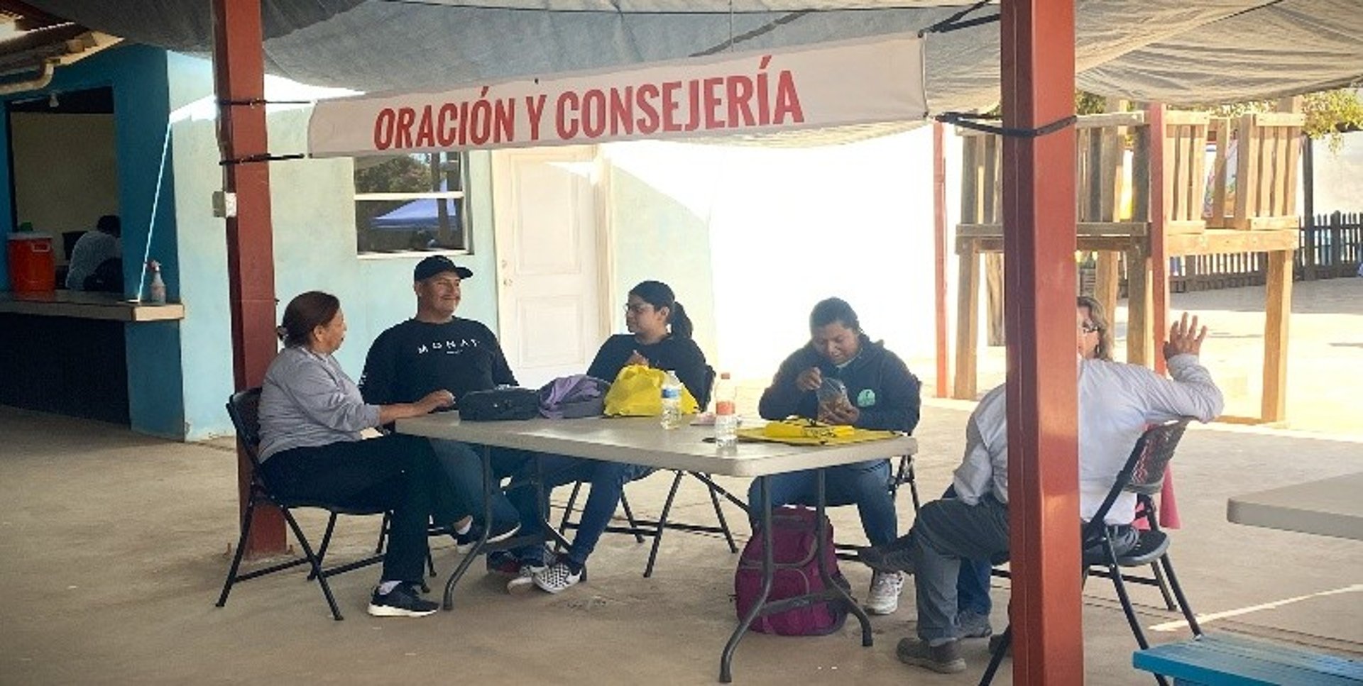 an abstract photo of a curved building with a blue sky in the background