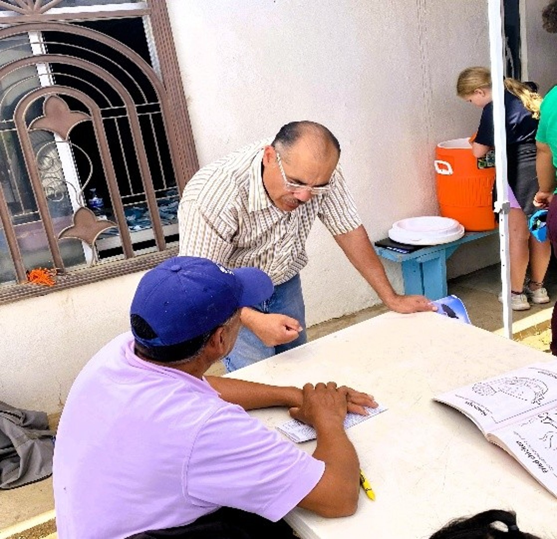 an abstract photo of a curved building with a blue sky in the background