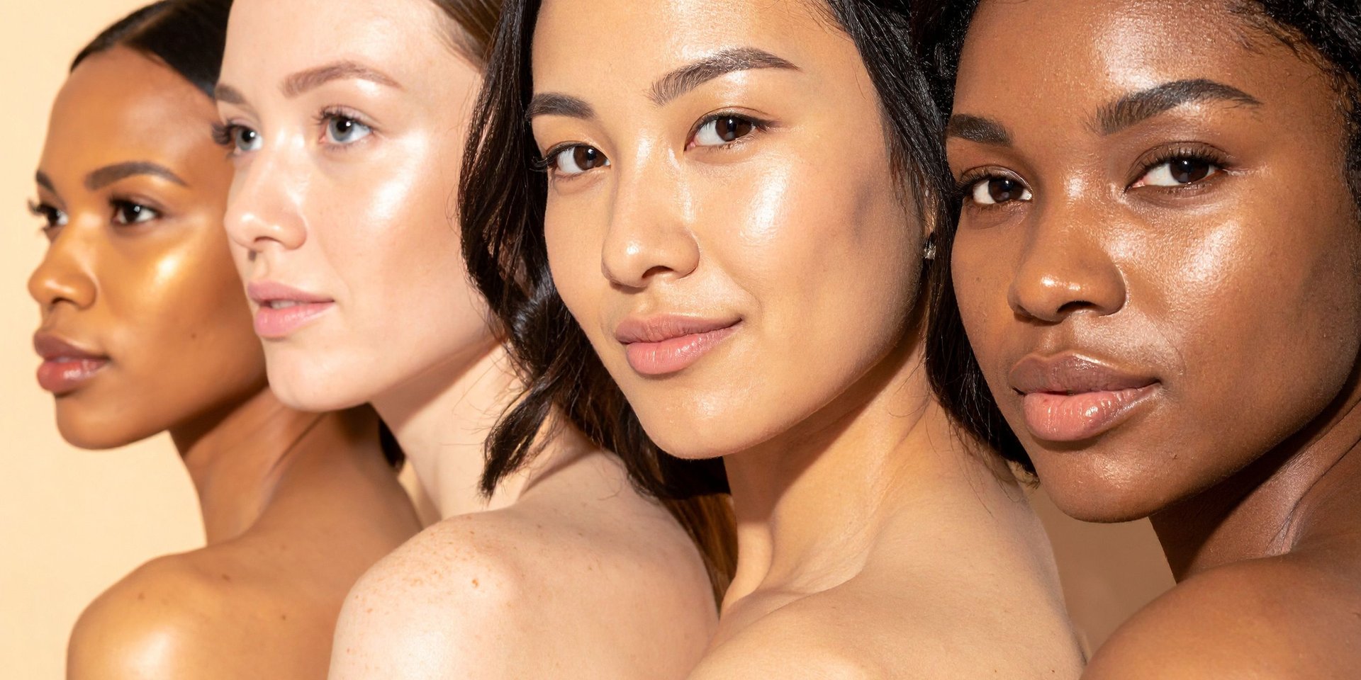 Four women with makeup lying down