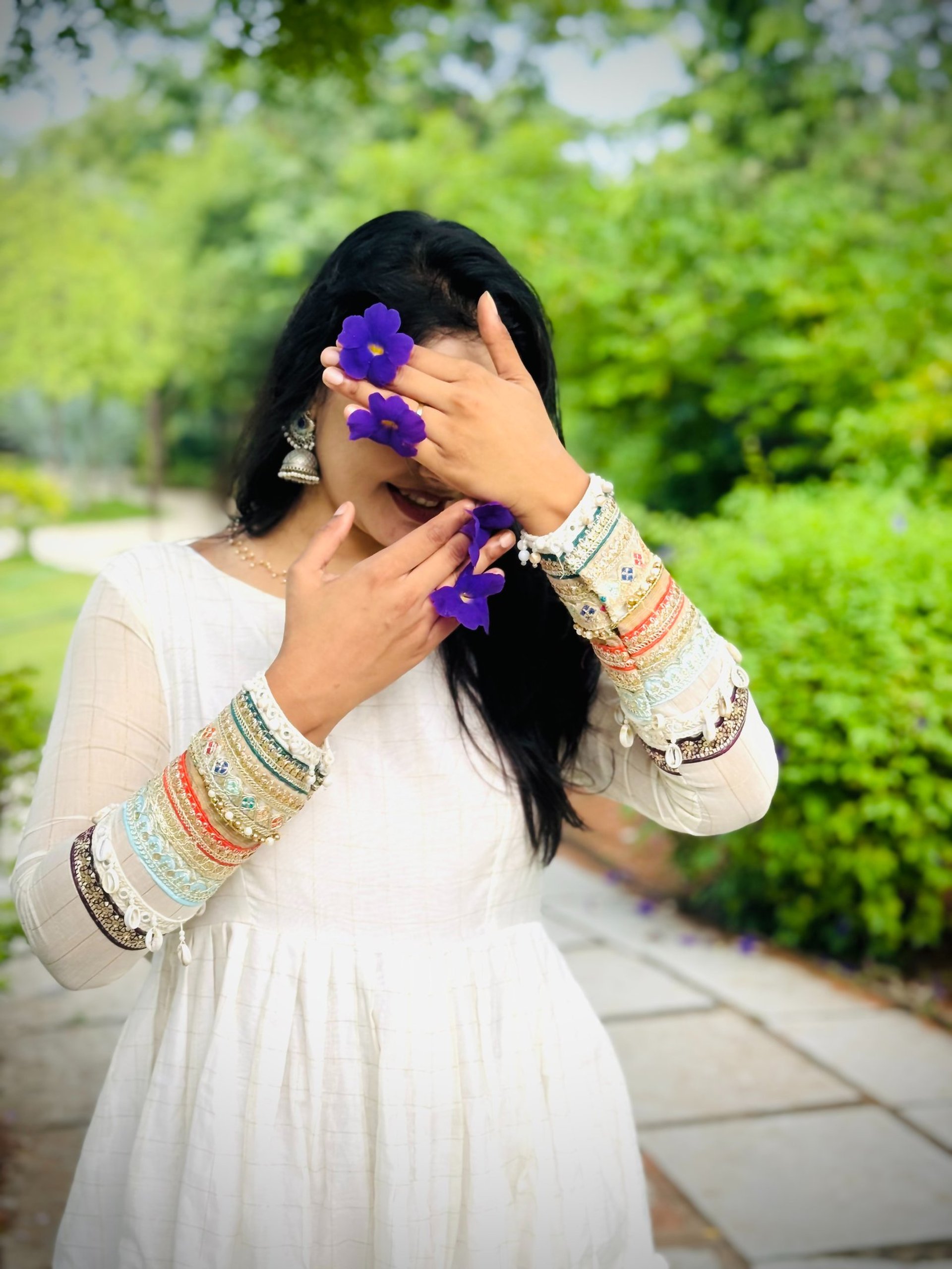 woman holding dried flower