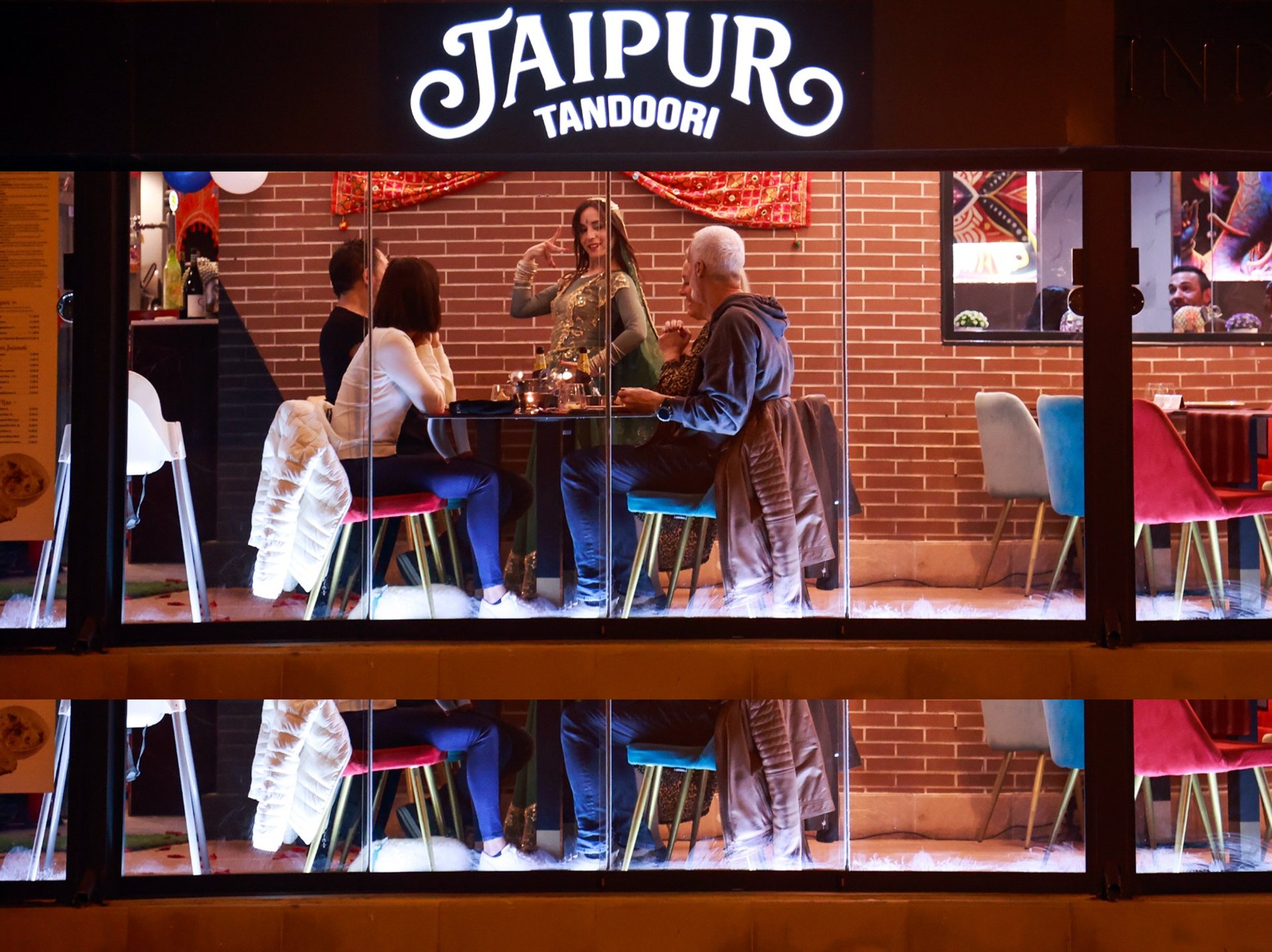 a large wooden door in a colorful building