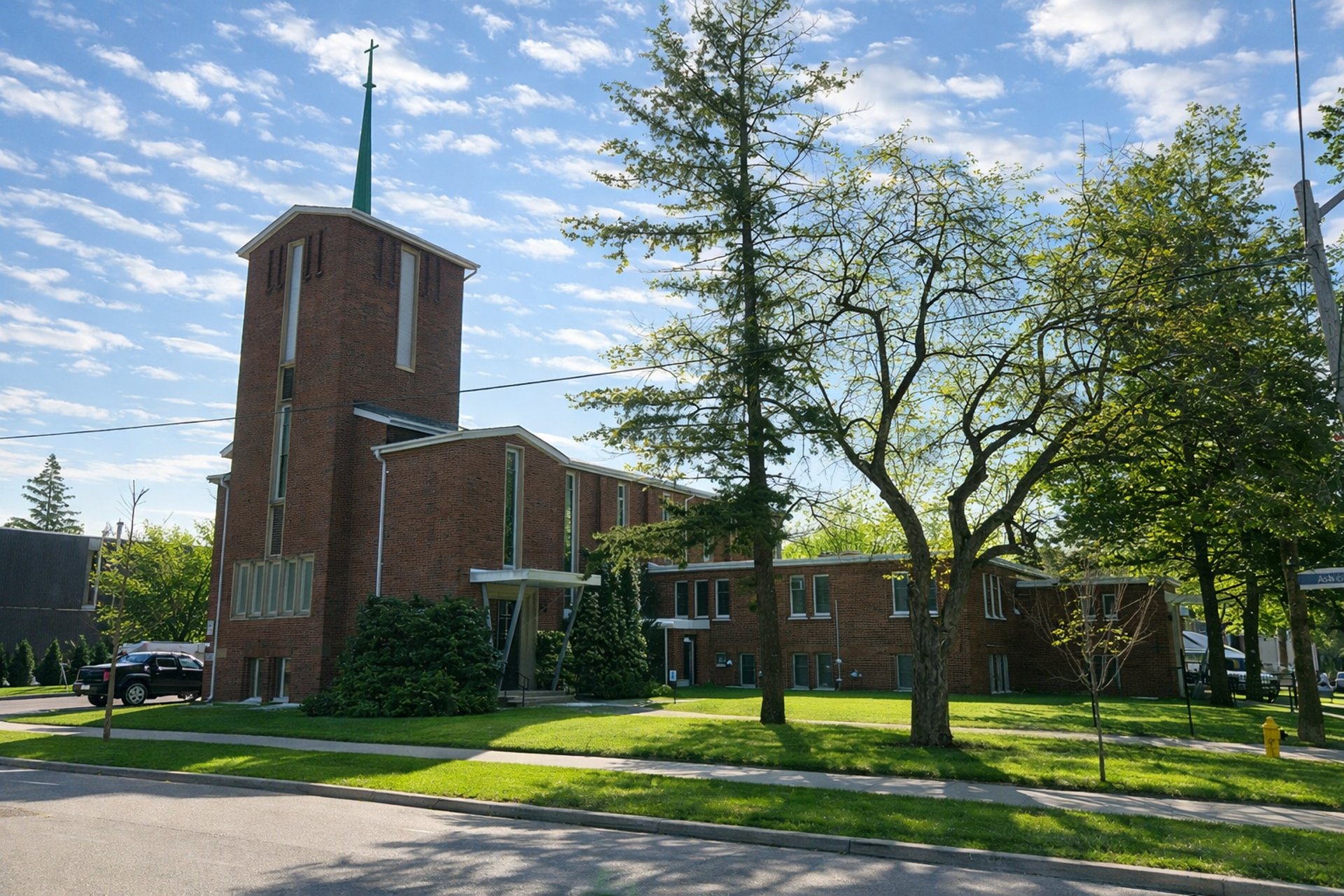 an abstract photo of a curved building with a blue sky in the background