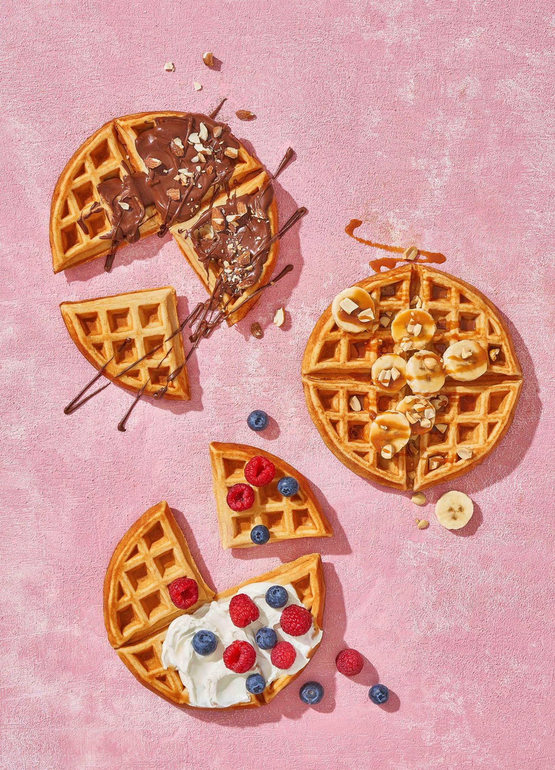 waffle on pink ceramic plate placed on wooden table