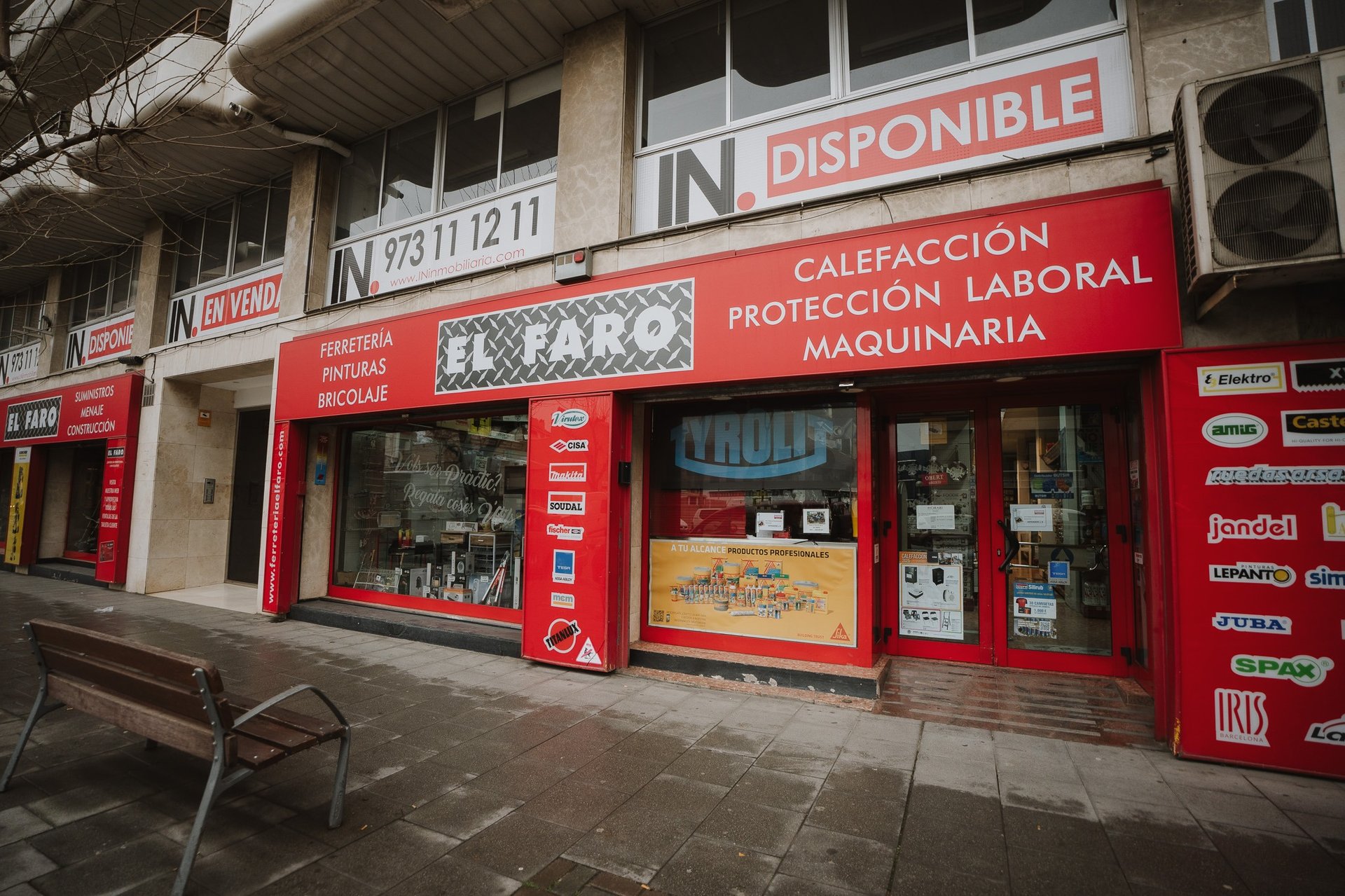 an abstract photo of a curved building with a blue sky in the background