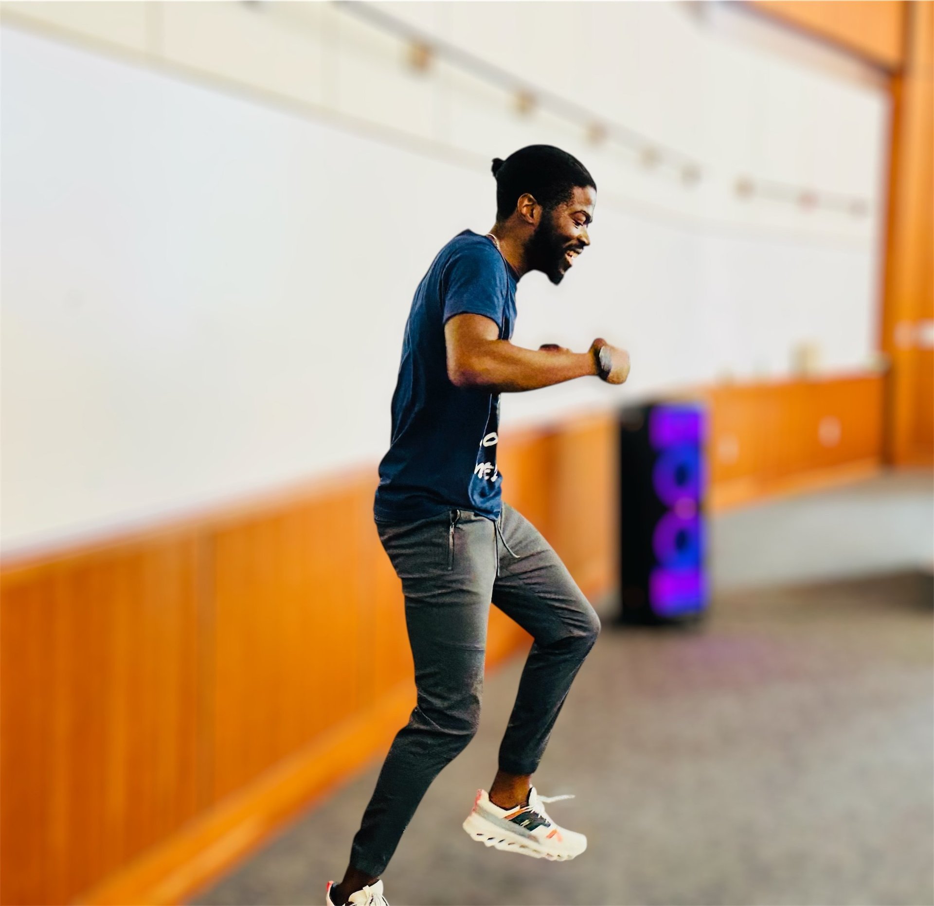 A man in a black shirt is doing push ups