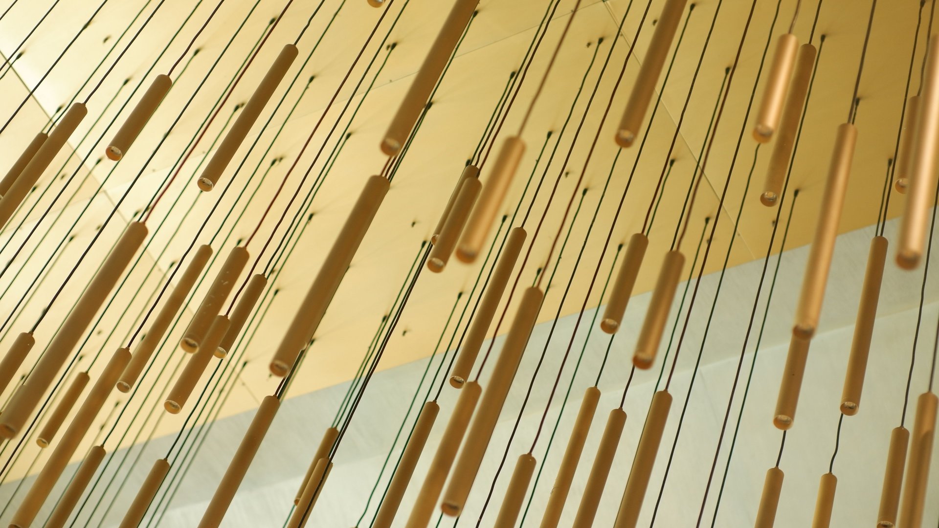 an abstract photo of a curved building with a blue sky in the background