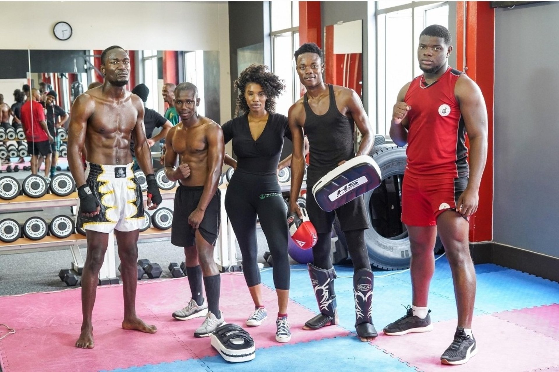 man and woman standing in front of brown concrete building during daytime
