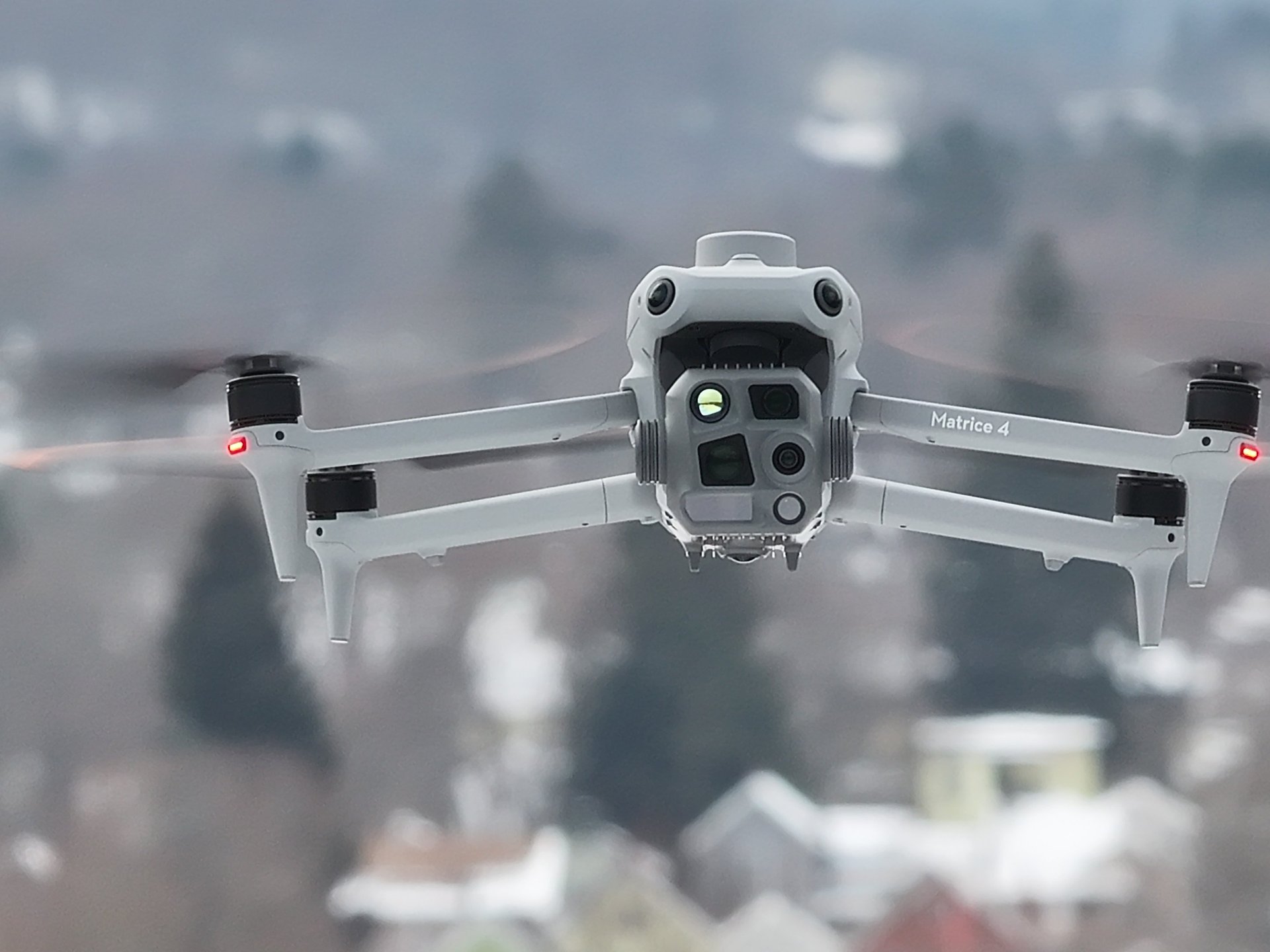 an aerial view of a road in the middle of a field