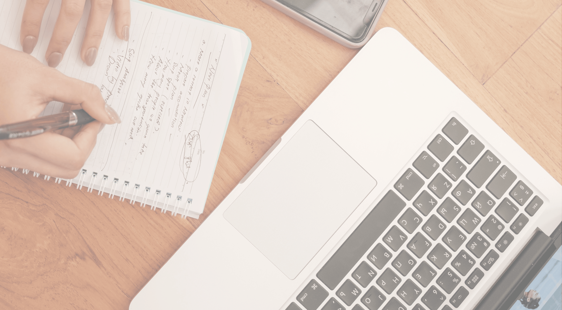 person using microsoft surface laptop on lap with two other people