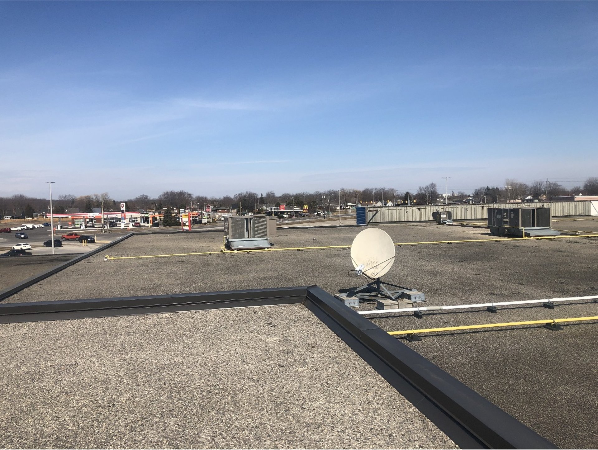 woman wearing yellow long-sleeved dress under white clouds and blue sky during daytime