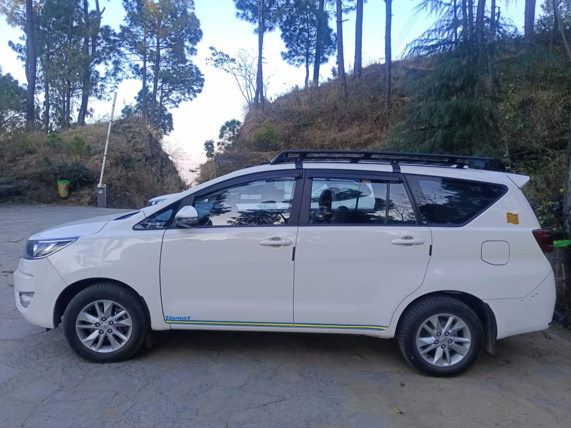 woman wearing yellow long-sleeved dress under white clouds and blue sky during daytime
