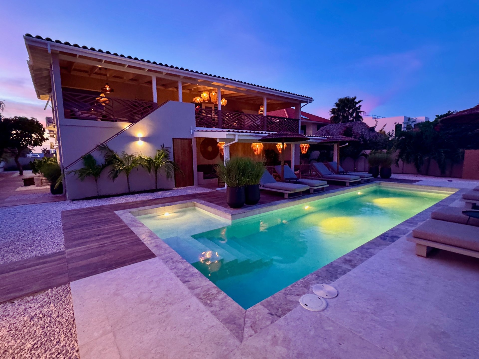 an abstract photo of a curved building with a blue sky in the background