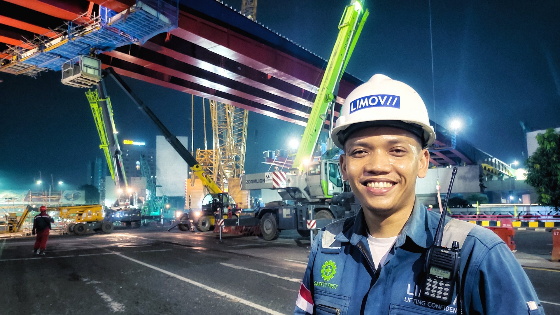 A cable-stayed bridge spans water at dusk.