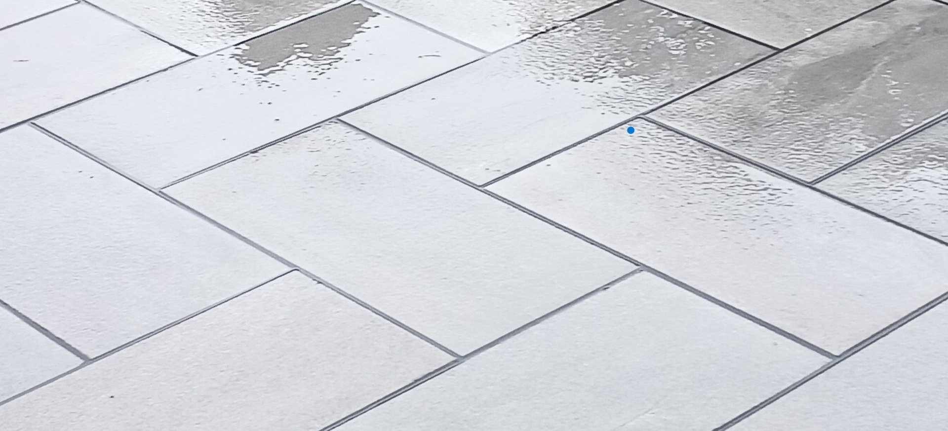 an abstract photo of a curved building with a blue sky in the background