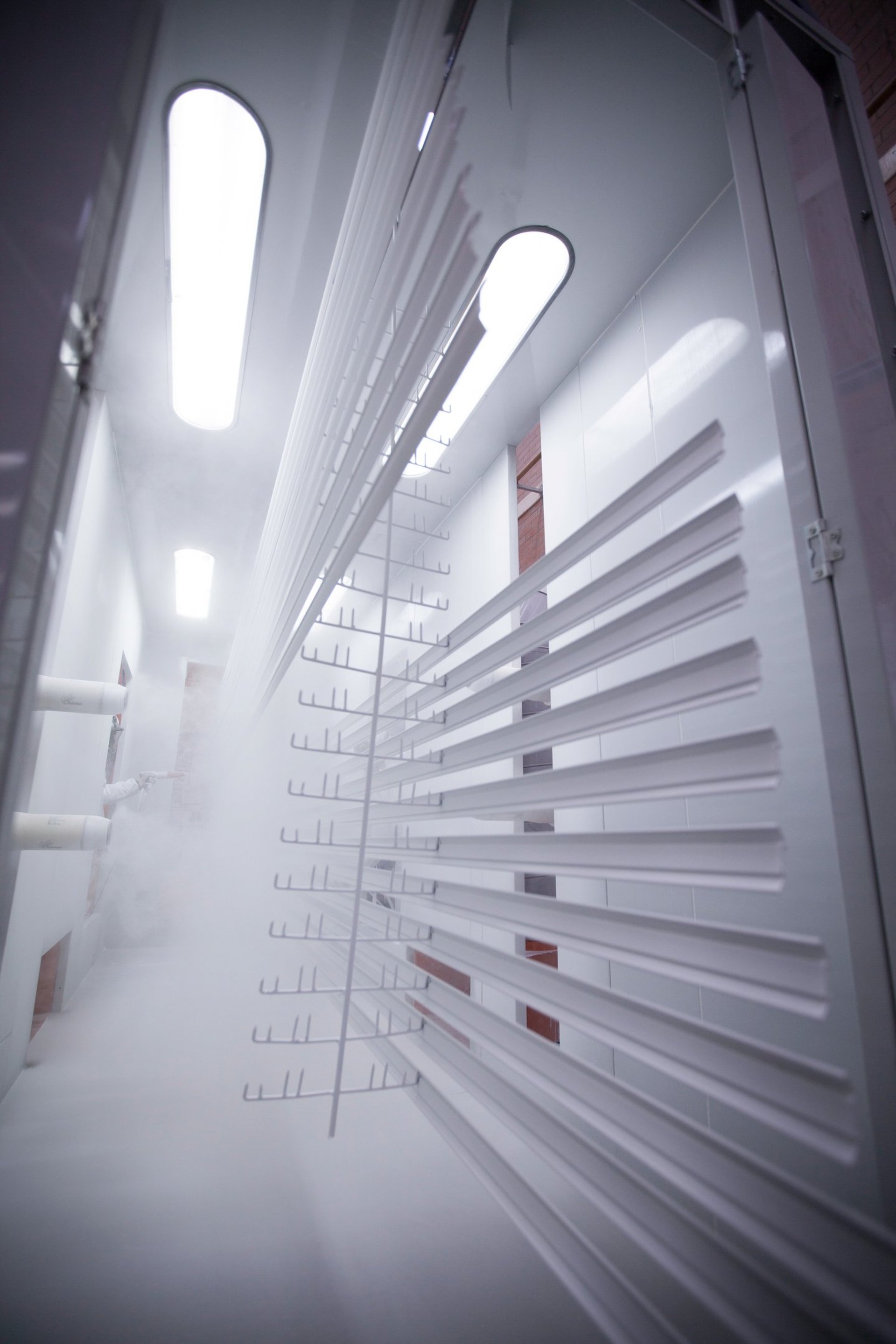 an abstract photo of a curved building with a blue sky in the background