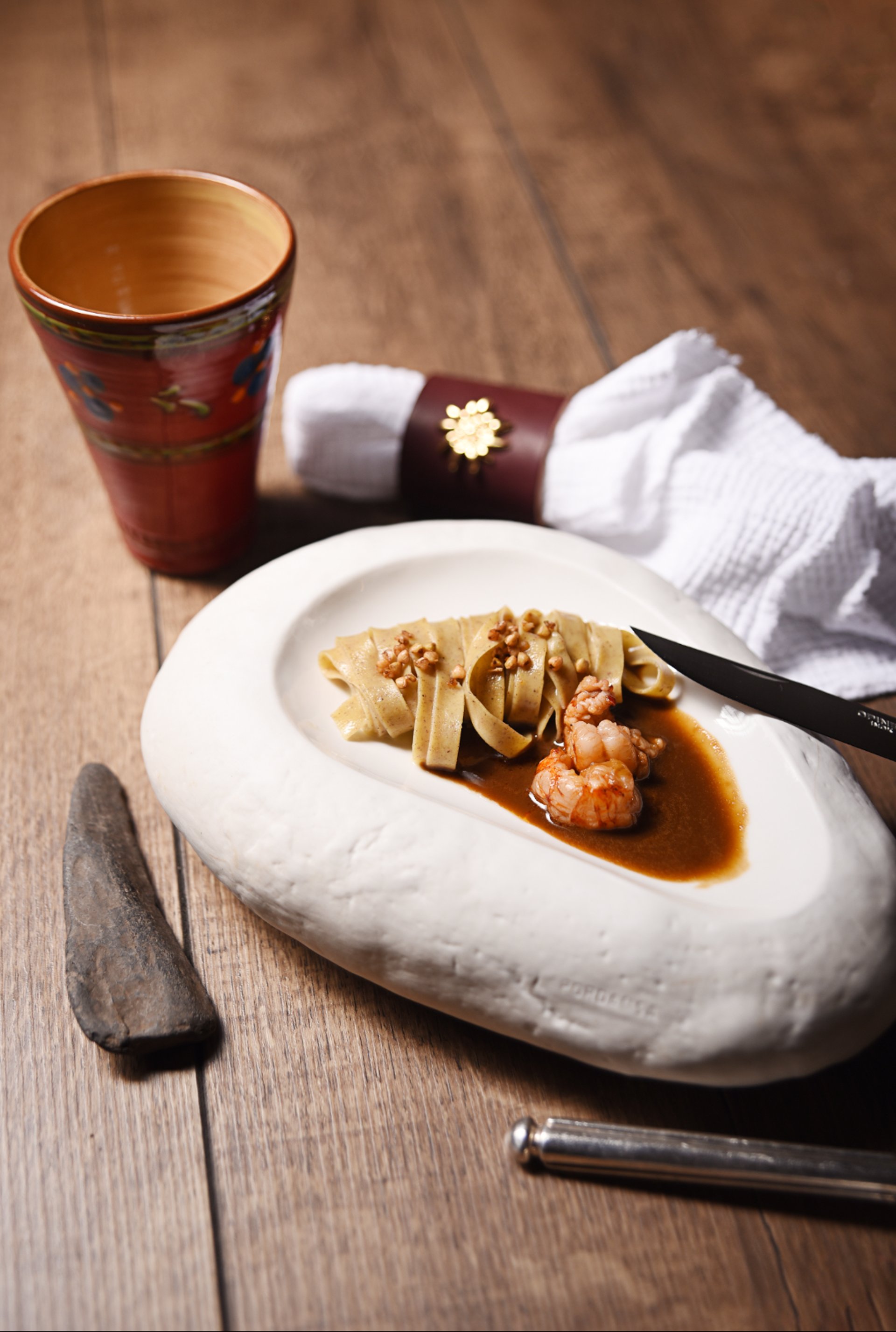 an abstract photo of a curved building with a blue sky in the background