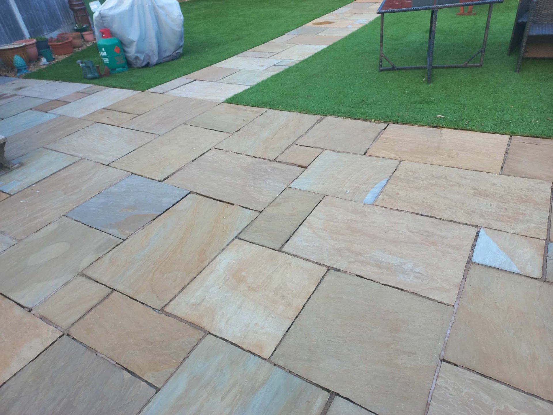 an abstract photo of a curved building with a blue sky in the background