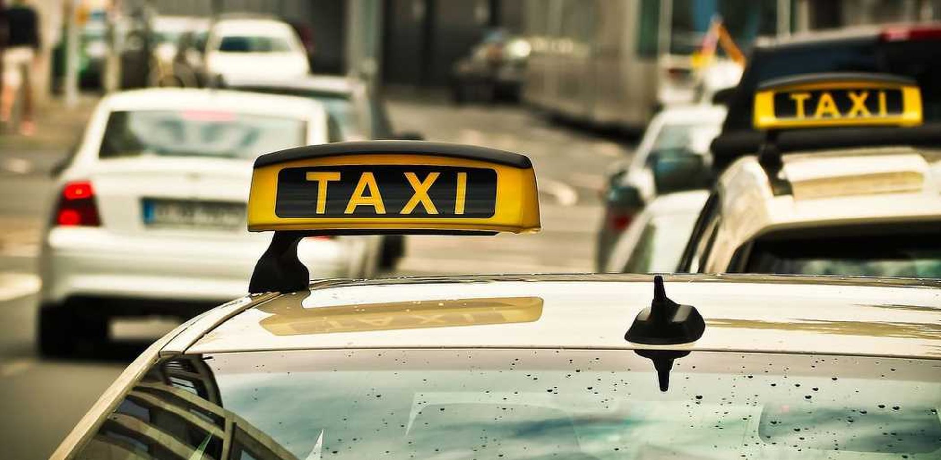 woman wearing yellow long-sleeved dress under white clouds and blue sky during daytime