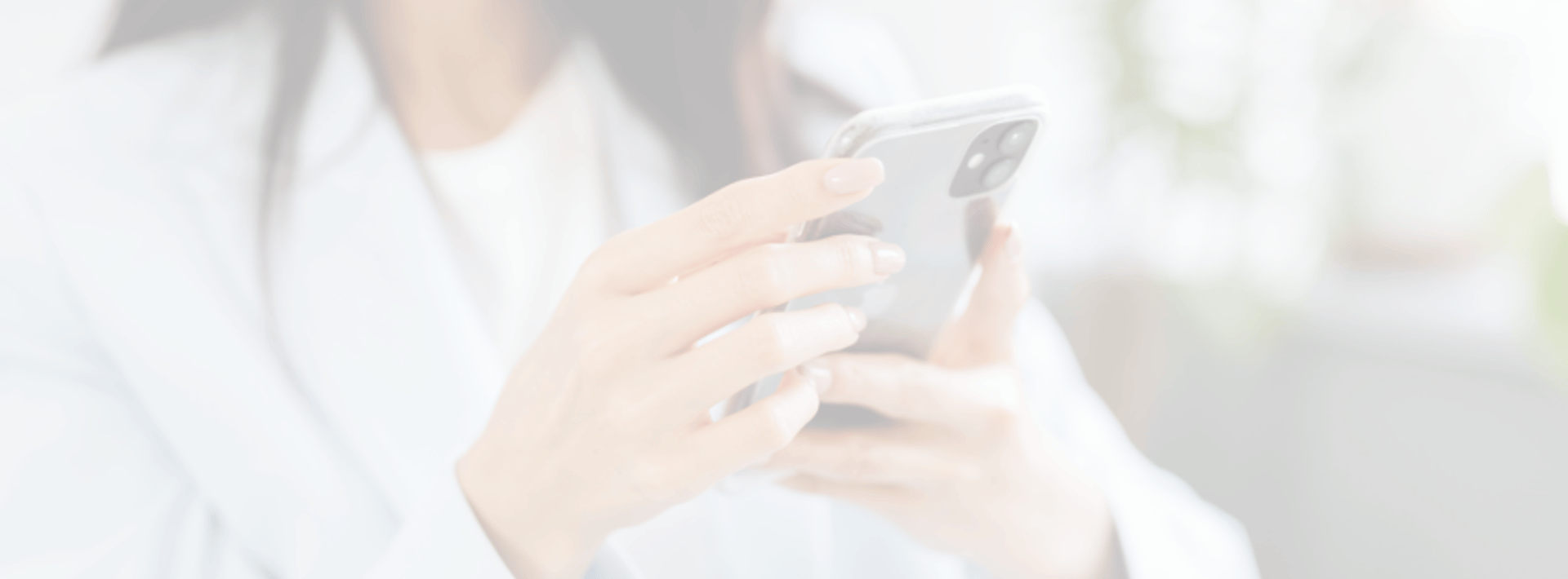 person holding white Android smartphone in white shirt