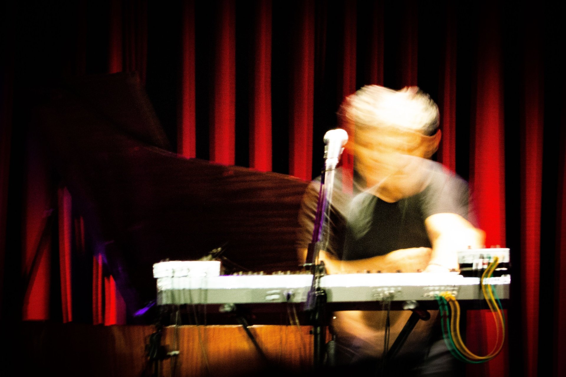 an abstract photo of a curved building with a blue sky in the background