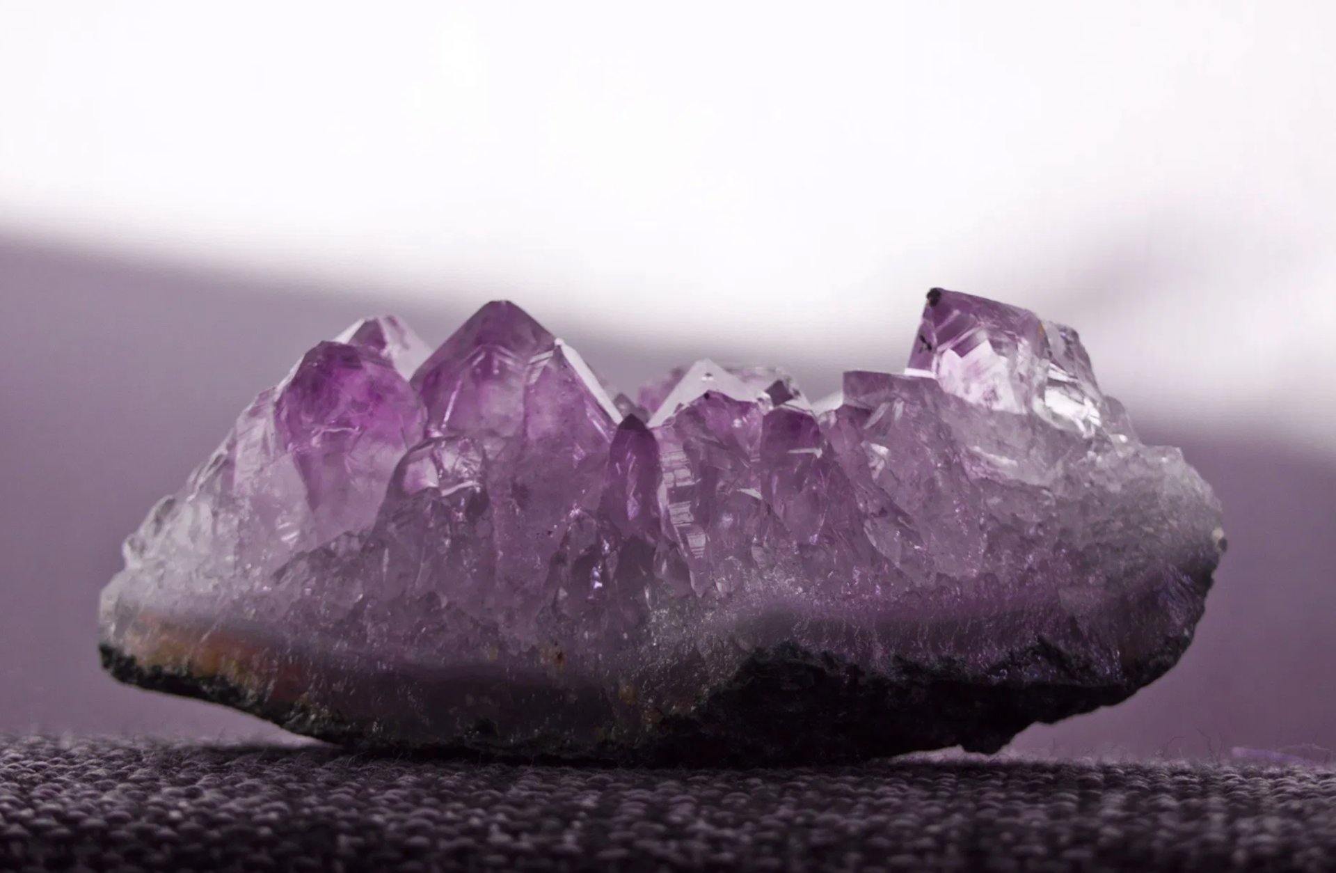 an abstract photo of a curved building with a blue sky in the background