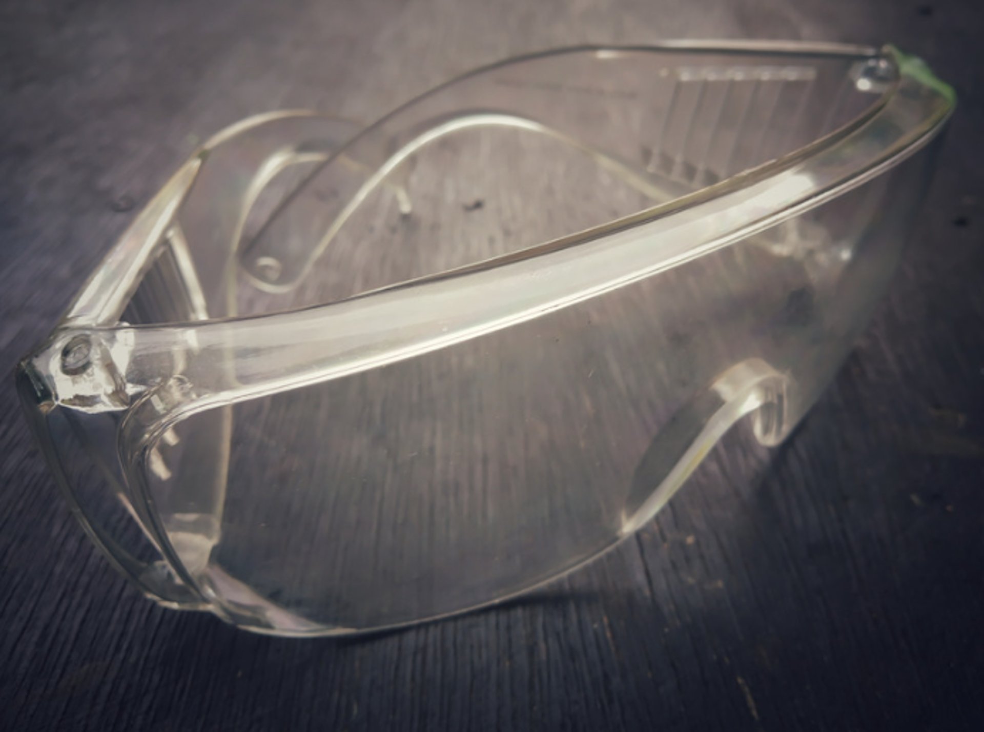 an abstract photo of a curved building with a blue sky in the background