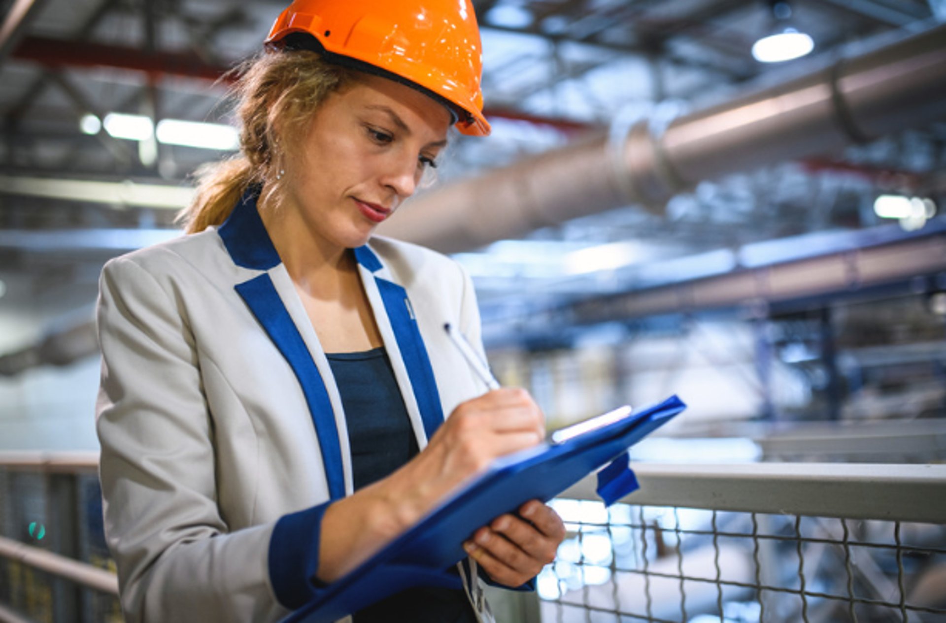 an abstract photo of a curved building with a blue sky in the background