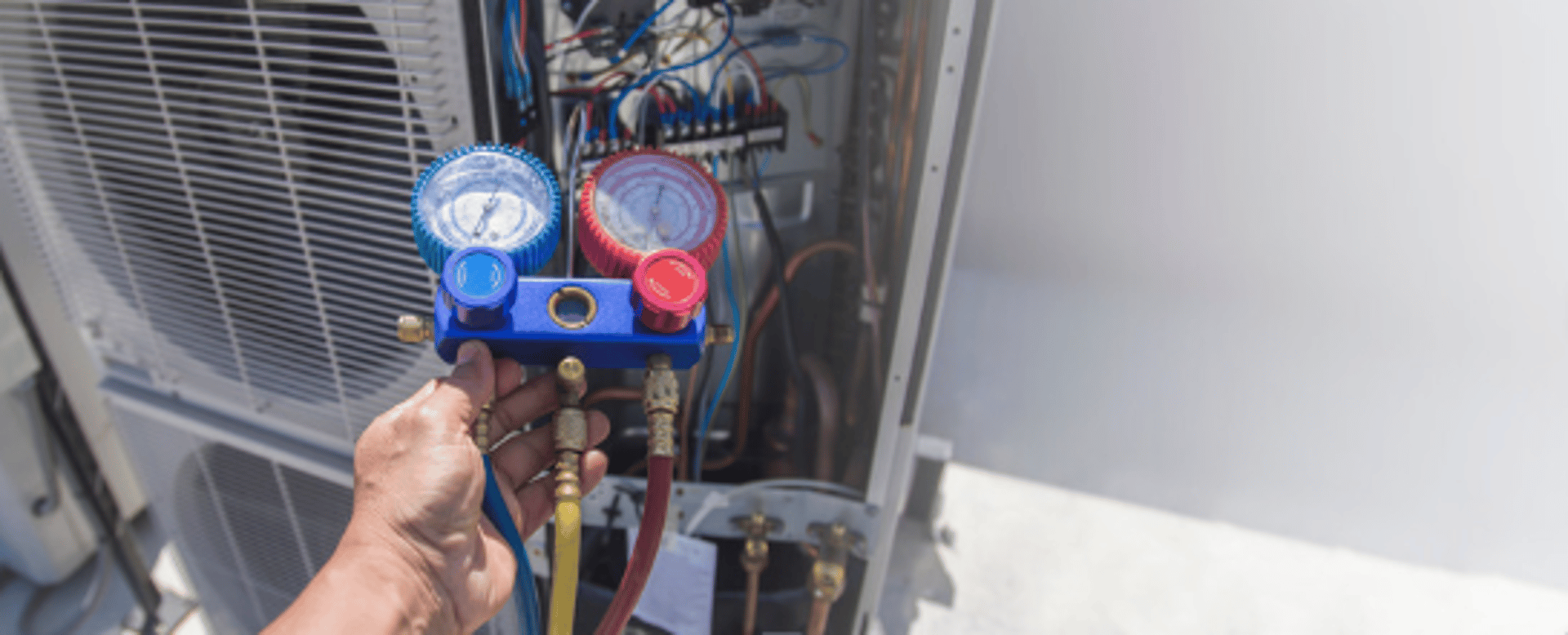an abstract photo of a curved building with a blue sky in the background