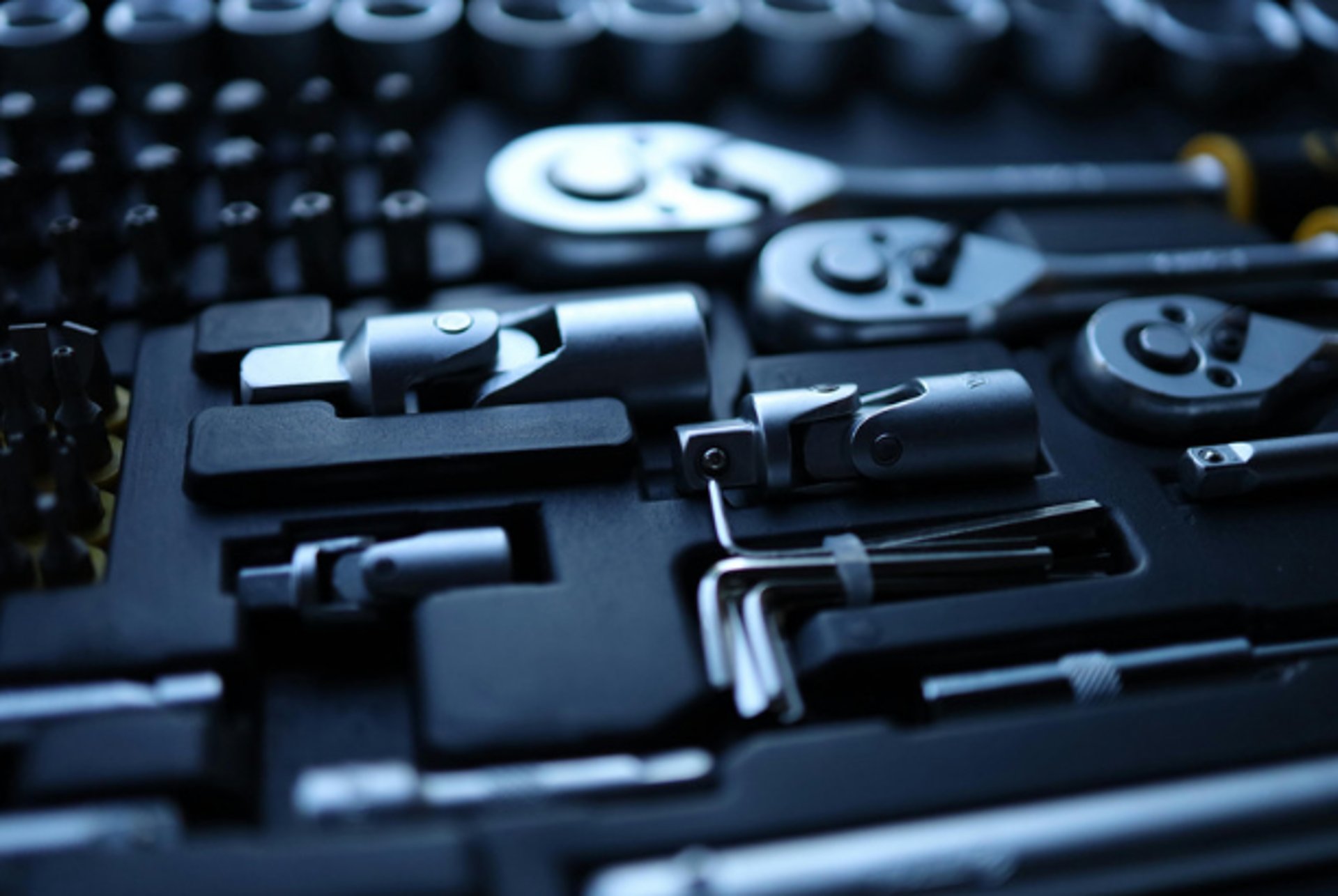 an abstract photo of a curved building with a blue sky in the background