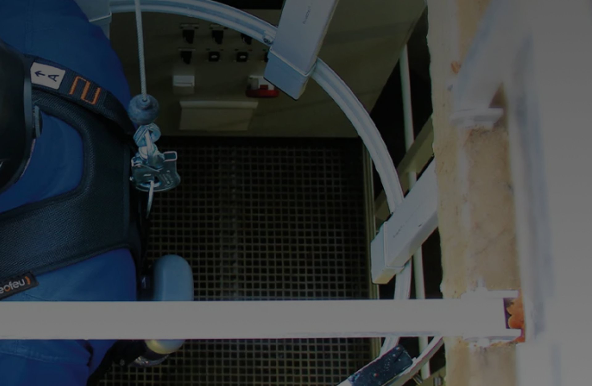 an abstract photo of a curved building with a blue sky in the background