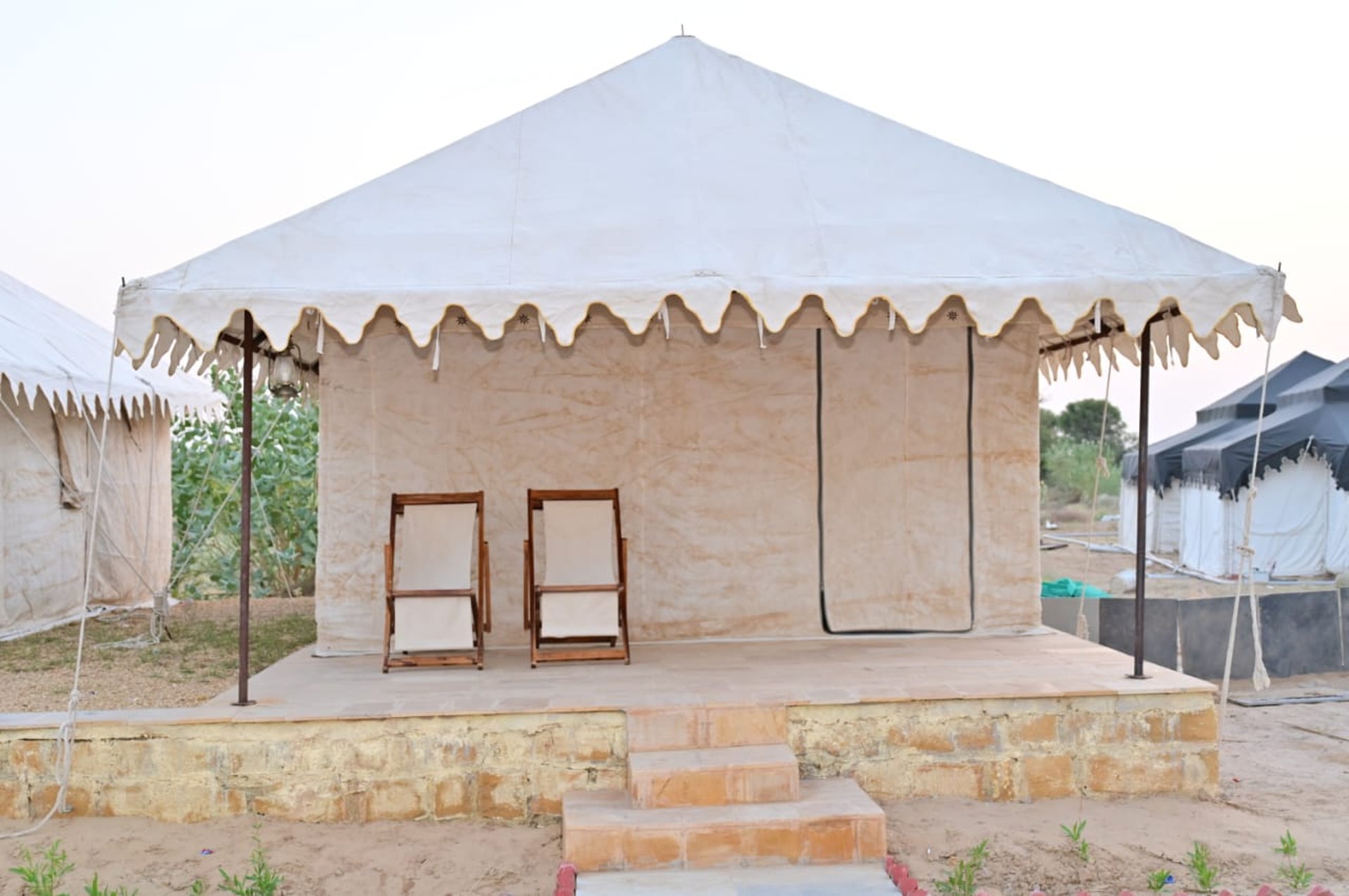 an abstract photo of a curved building with a blue sky in the background