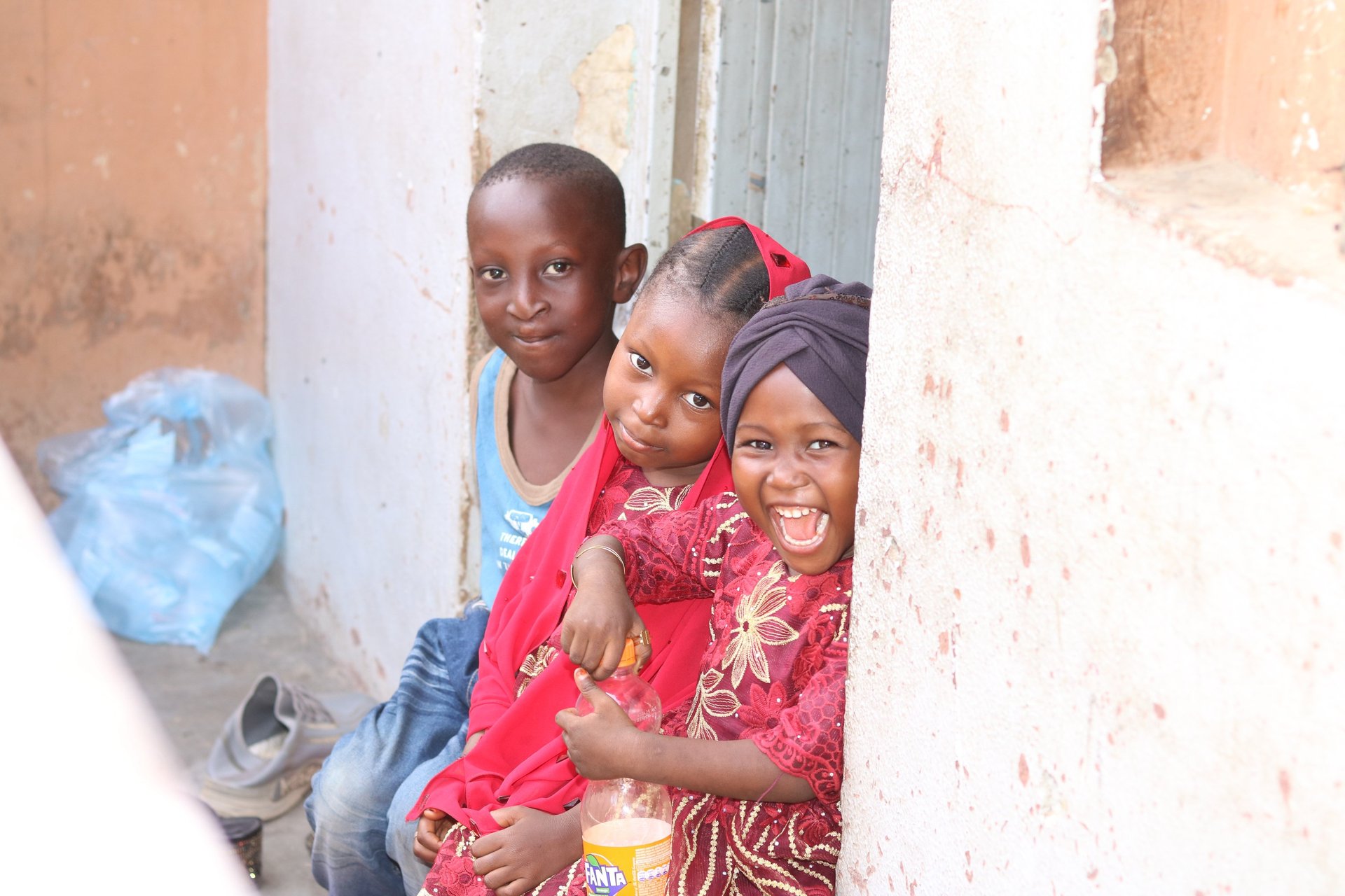 woman wearing yellow long-sleeved dress under white clouds and blue sky during daytime