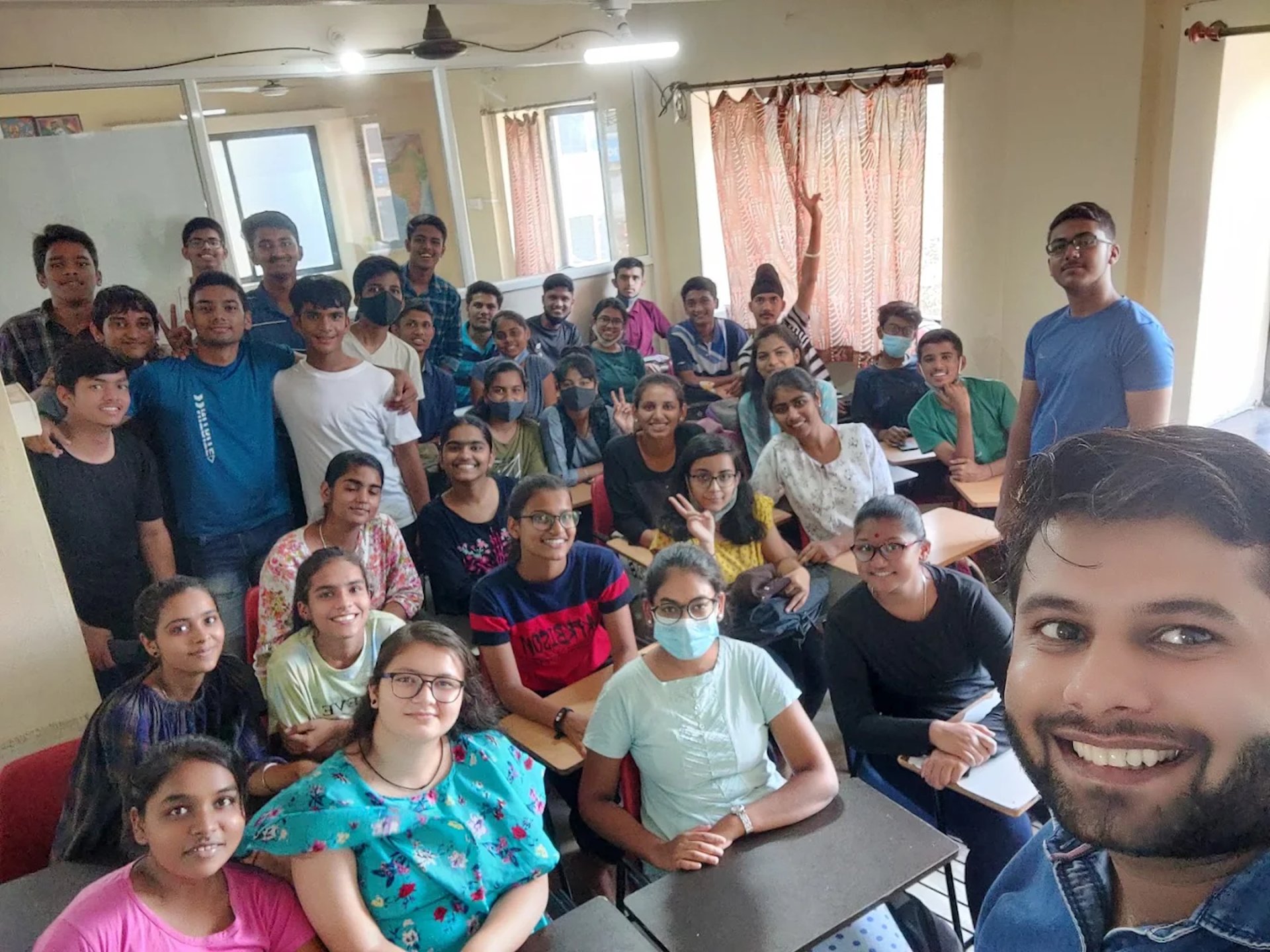 woman wearing yellow long-sleeved dress under white clouds and blue sky during daytime