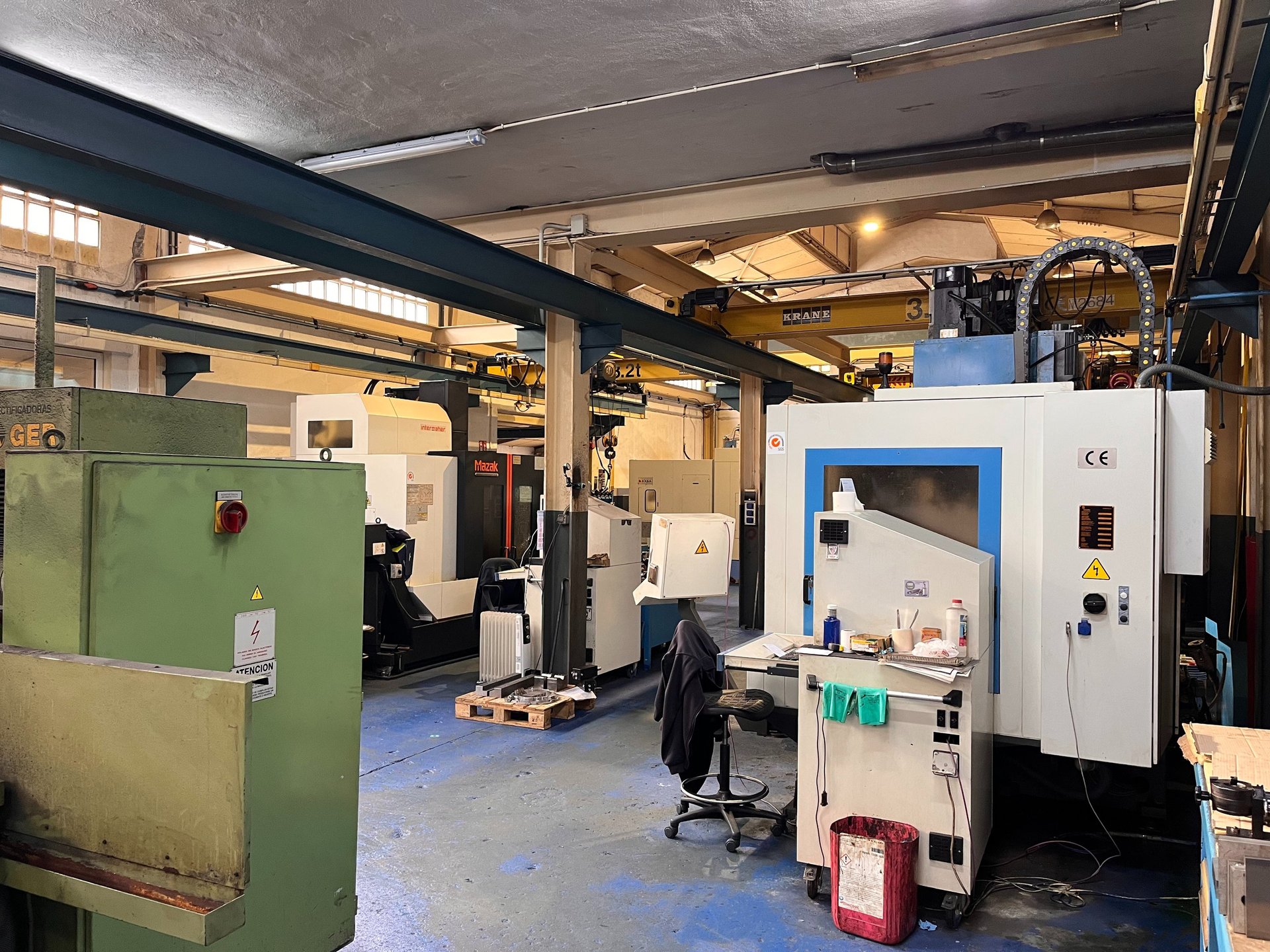 an abstract photo of a curved building with a blue sky in the background