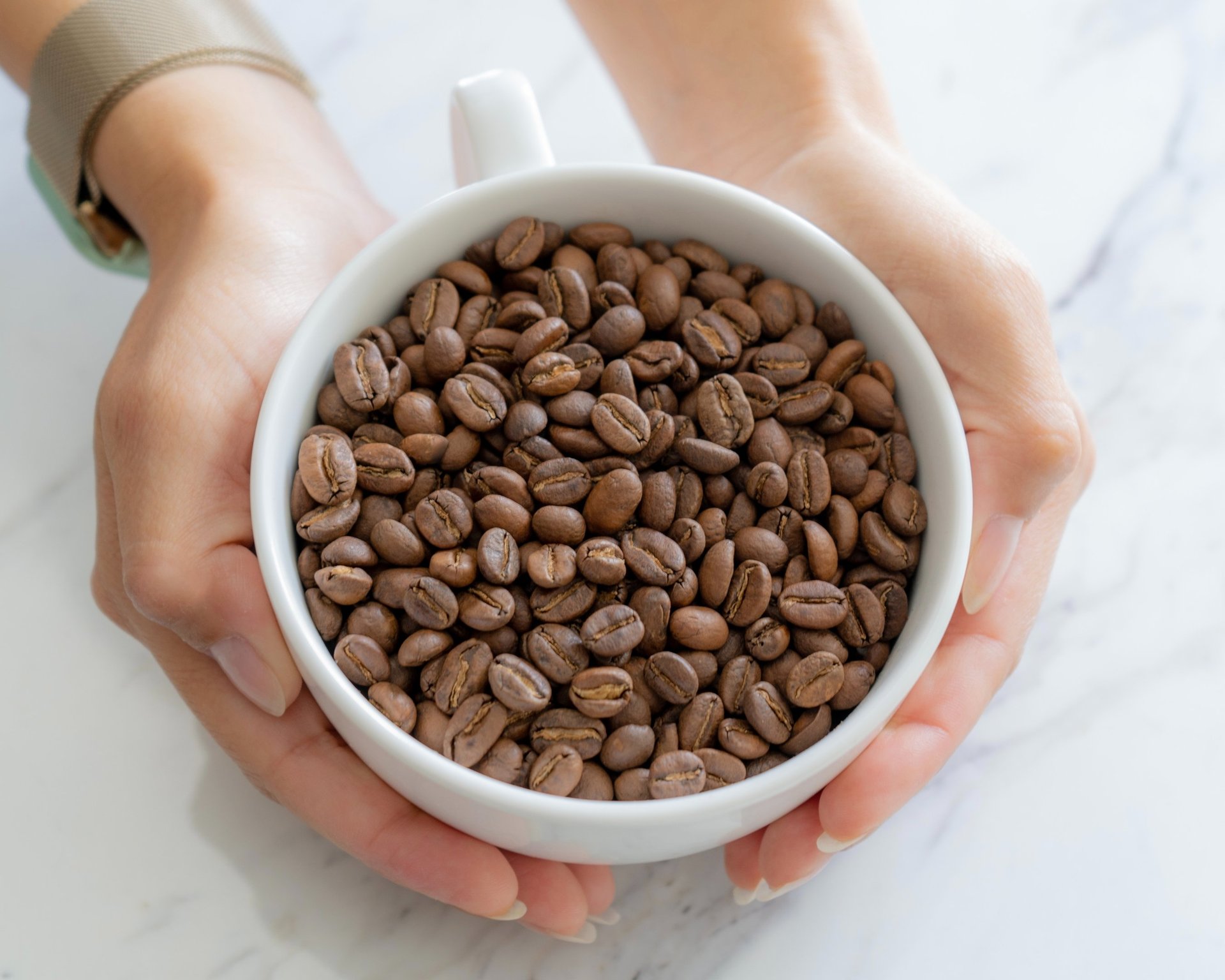 brown coffee beans on white table