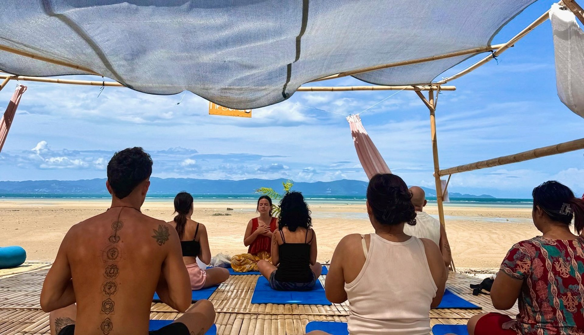 an abstract photo of a curved building with a blue sky in the background