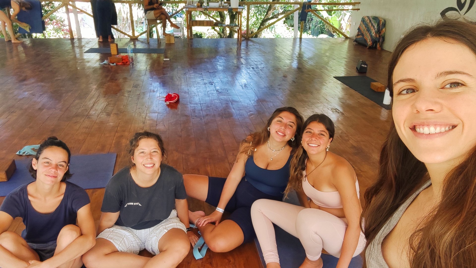 woman wearing yellow long-sleeved dress under white clouds and blue sky during daytime