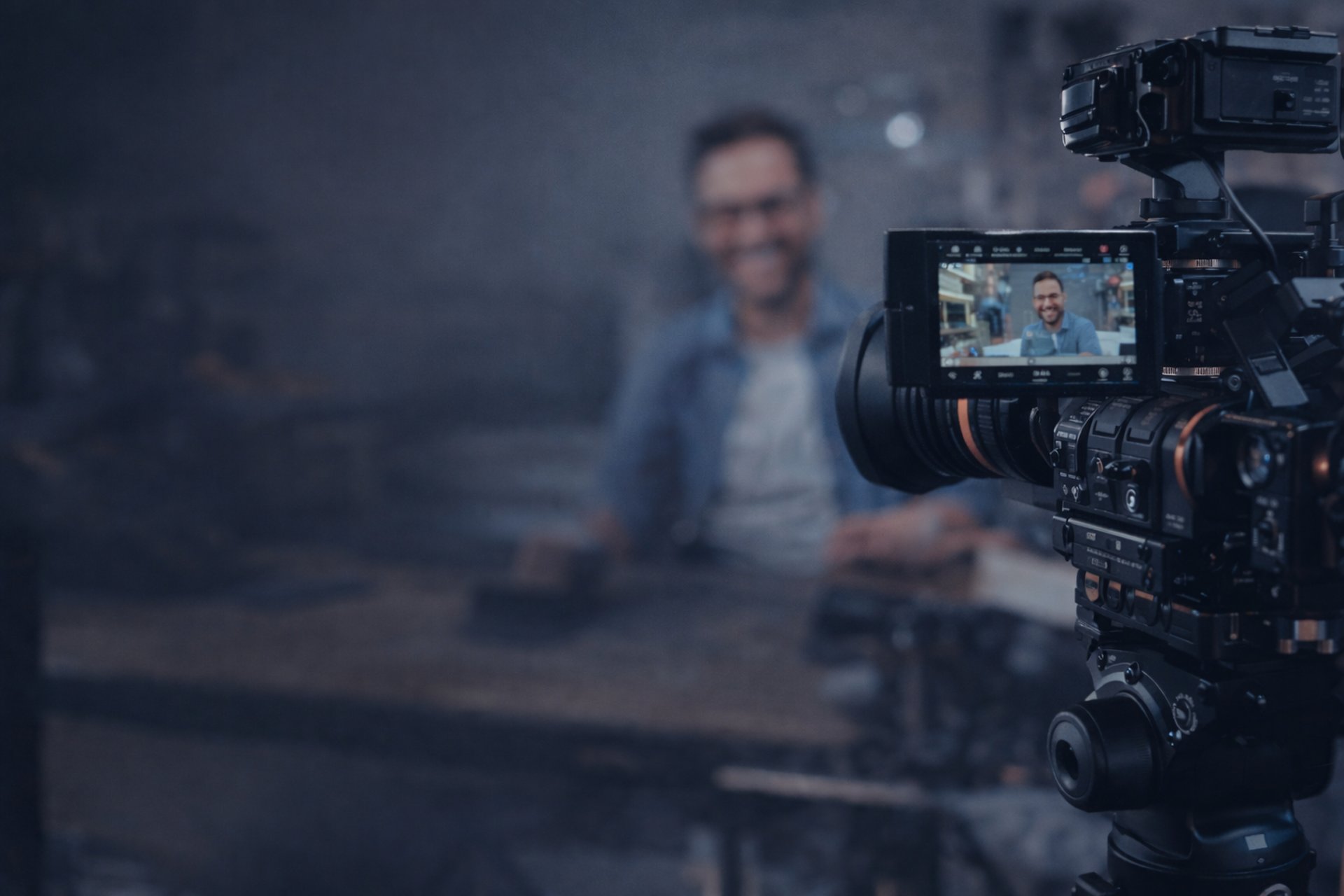 woman in pink shirt sitting in front of black laptop computer