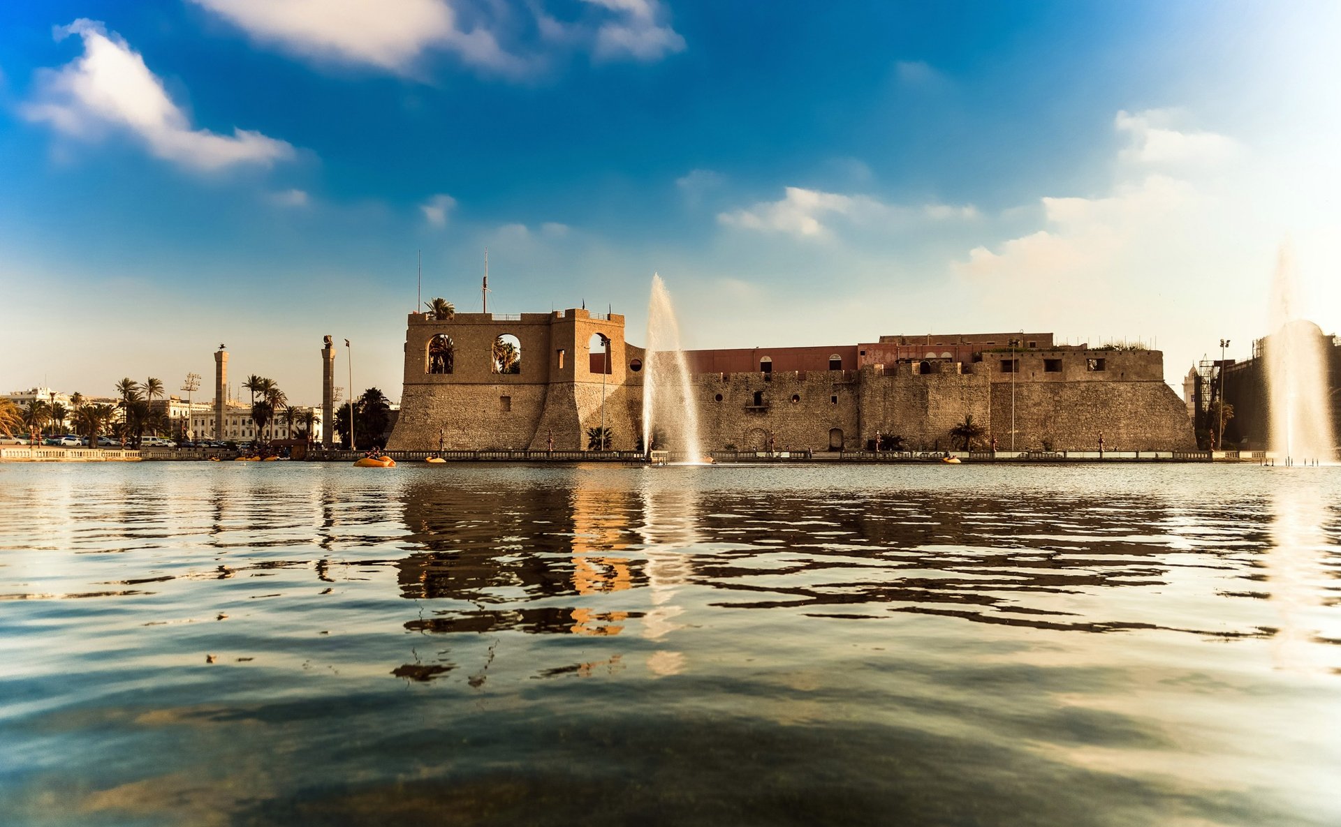 an abstract photo of a curved building with a blue sky in the background