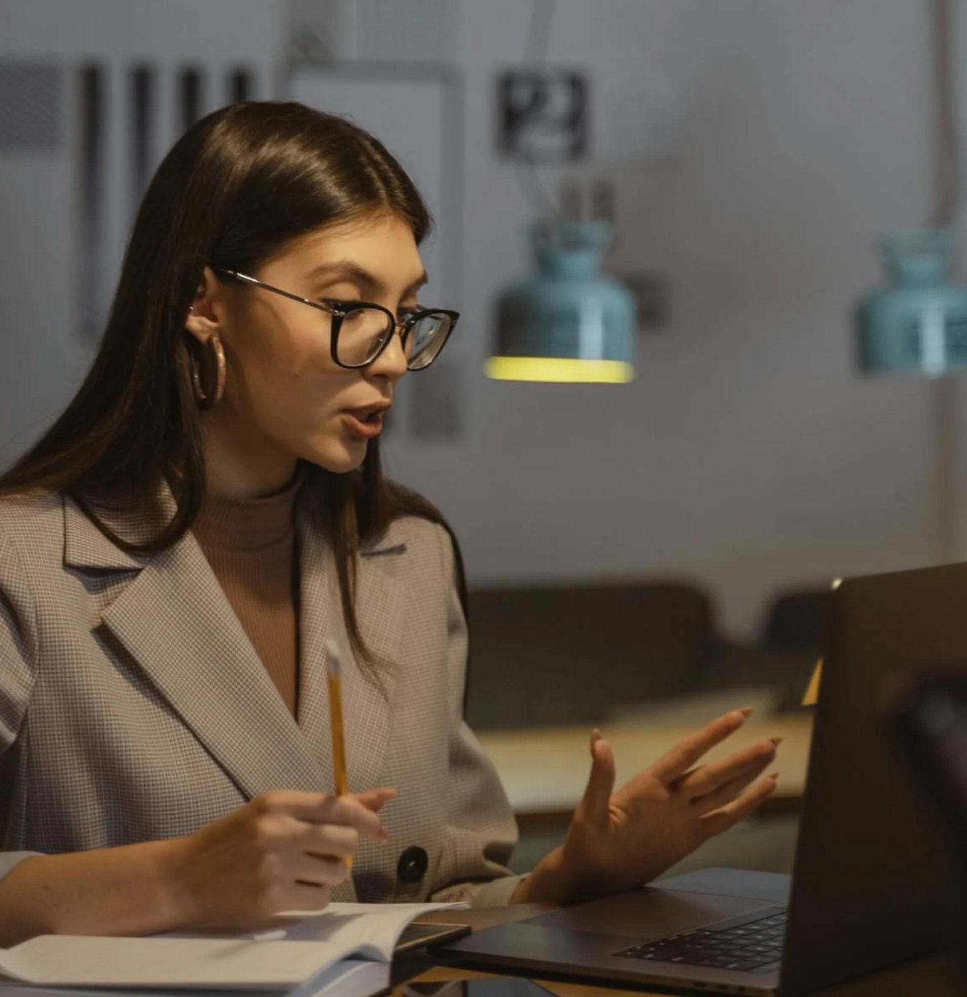 2 women sitting on black sofa