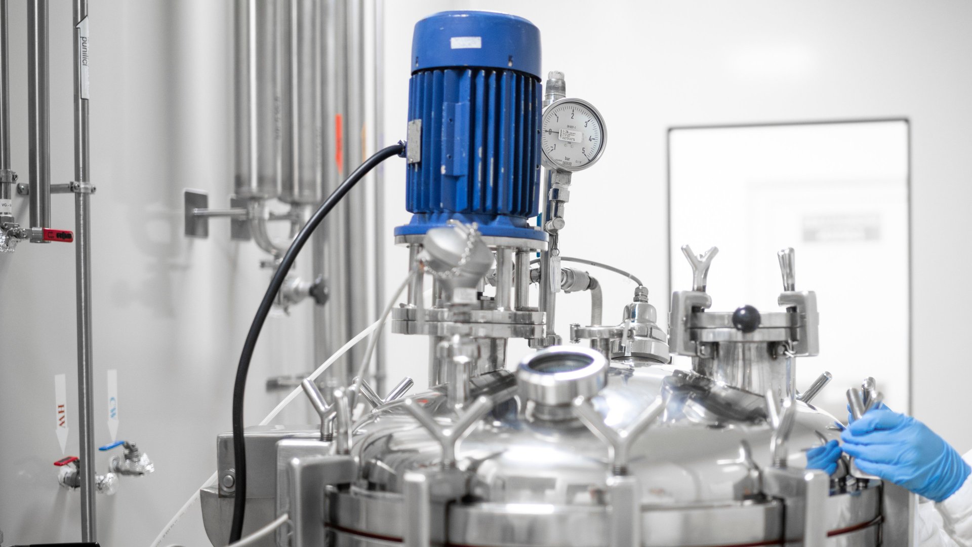 an abstract photo of a curved building with a blue sky in the background